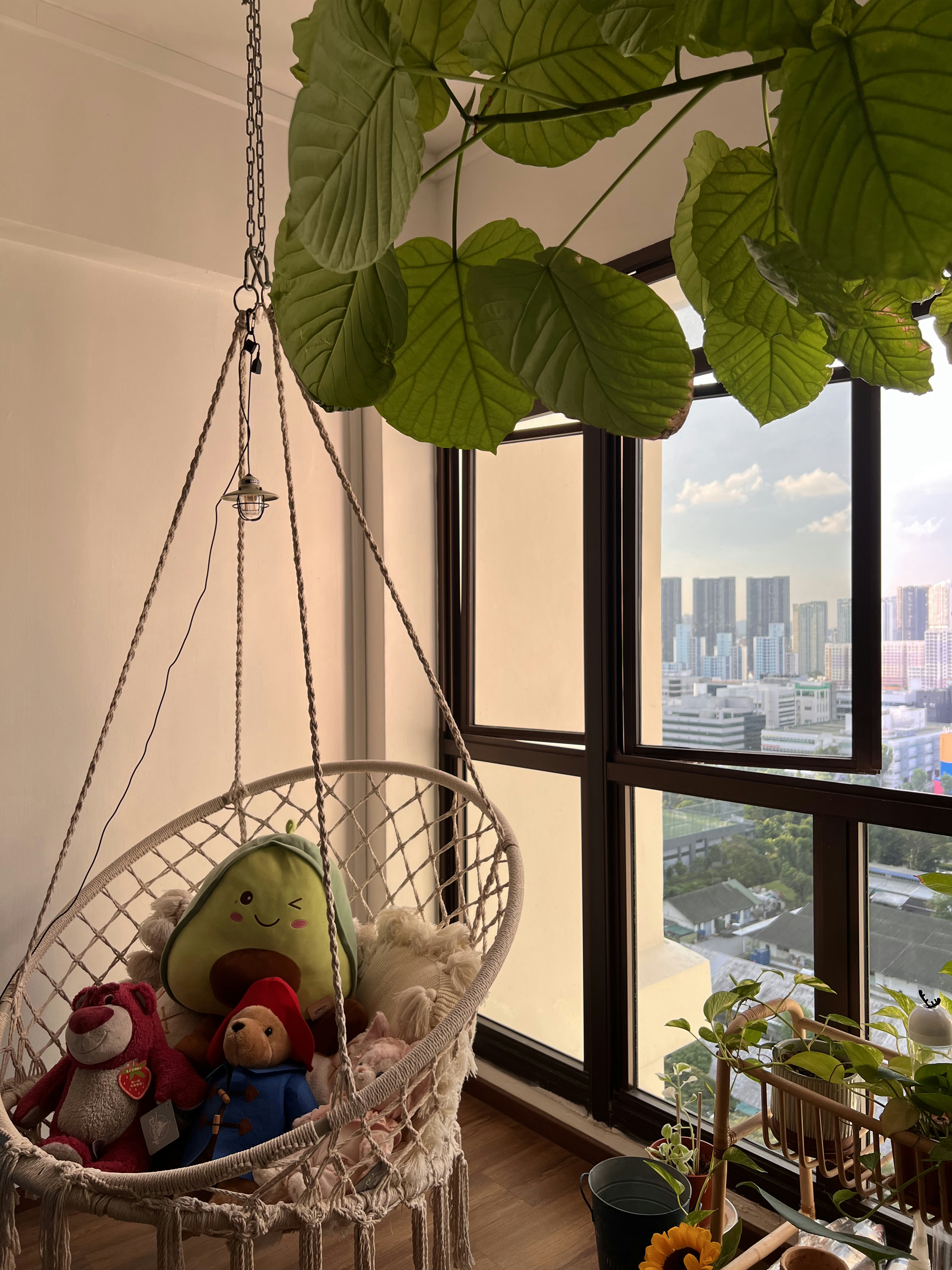 Ambient and Functional Lightings in a Classic Farmhouse HDB - Hanging green leaves from a window, plush toys in a hammock