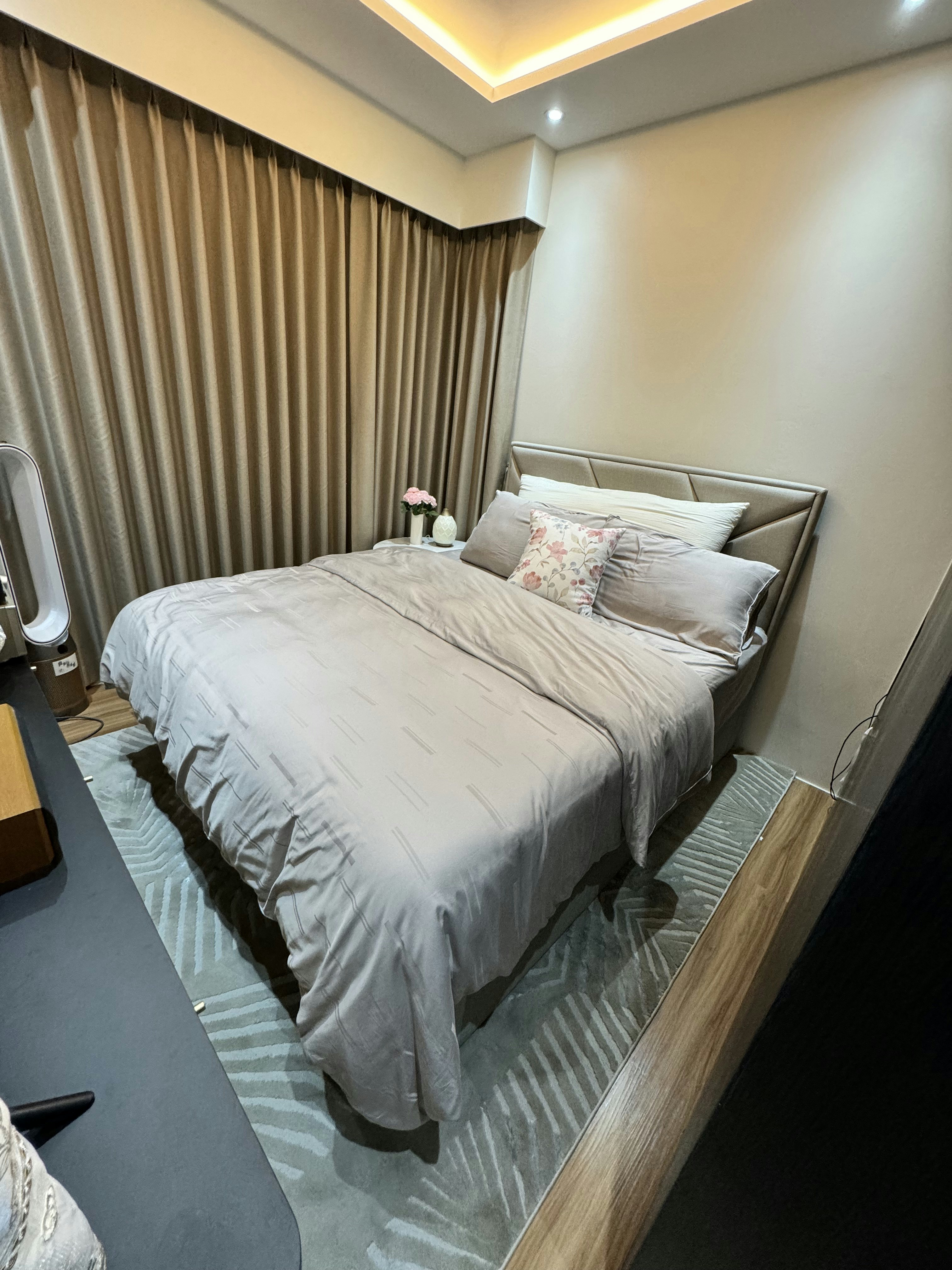 Cozy vibe with modern victorian style - Modern bedroom with neatly made bed, beige curtains, soft lighting, minimalist decor