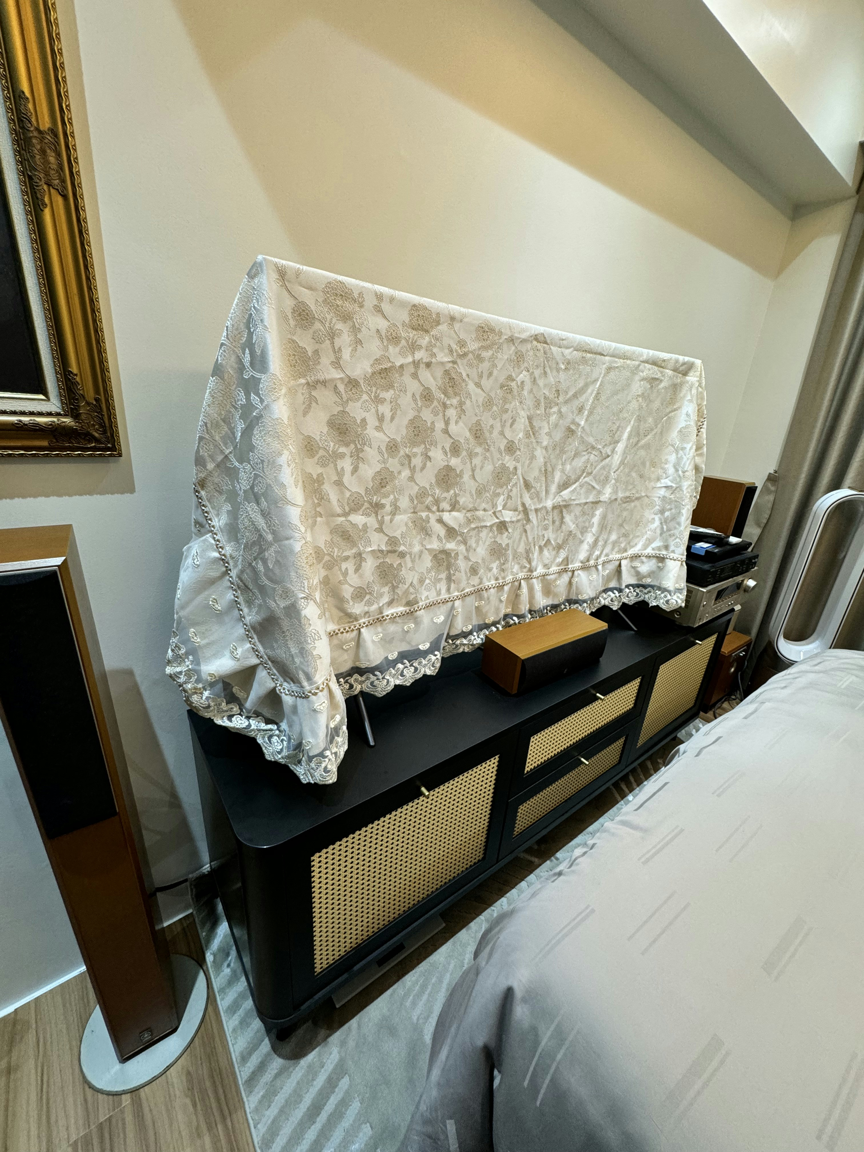 Cozy vibe with modern victorian style - White lace curtains, gold trim, black cabinet, wooden floor, gray bedspread