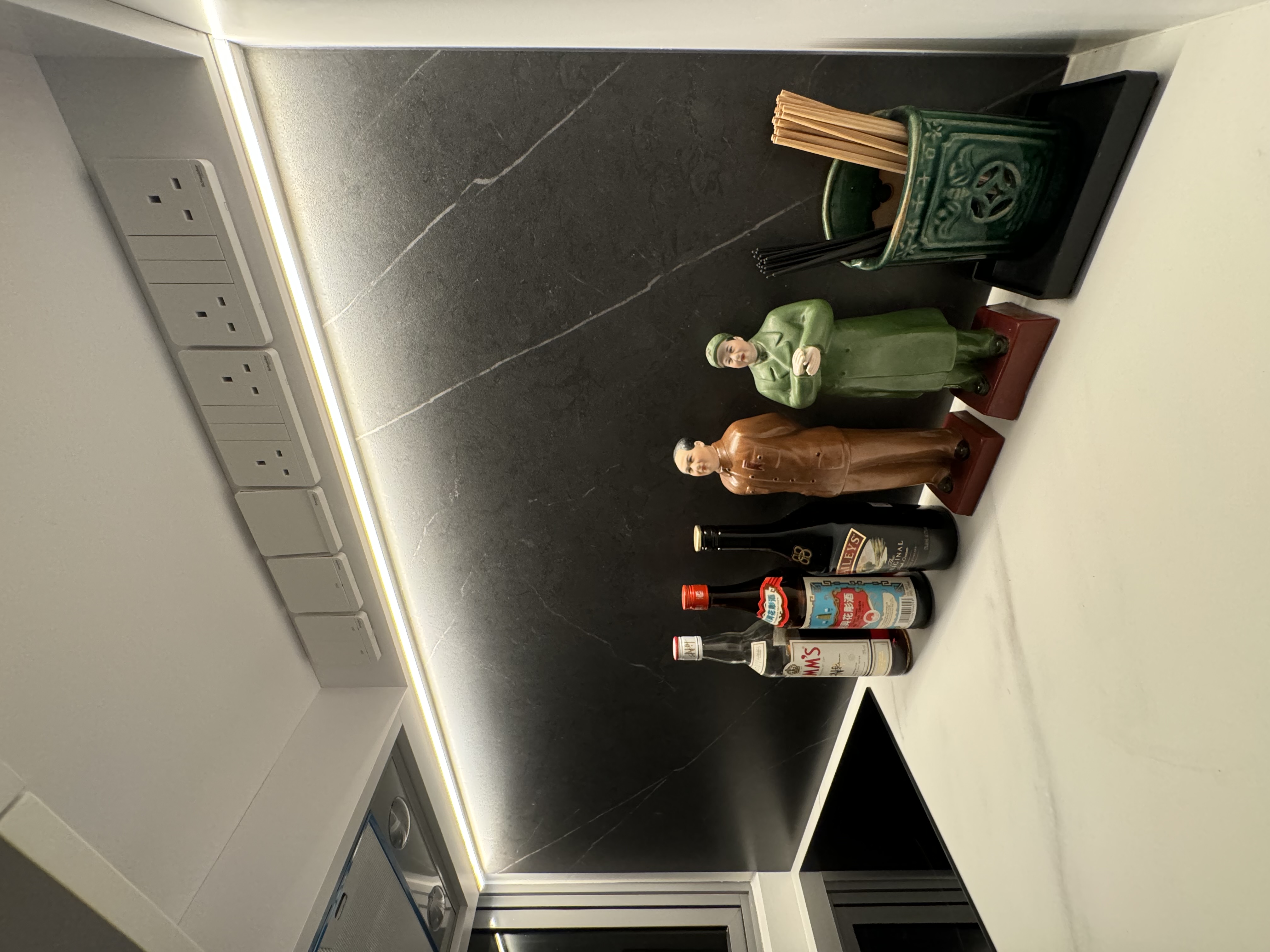 Let There Be Light! - modern kitchen countertop, minimalist design, sleek appliances, under-cabinet lighting, wall-mounted