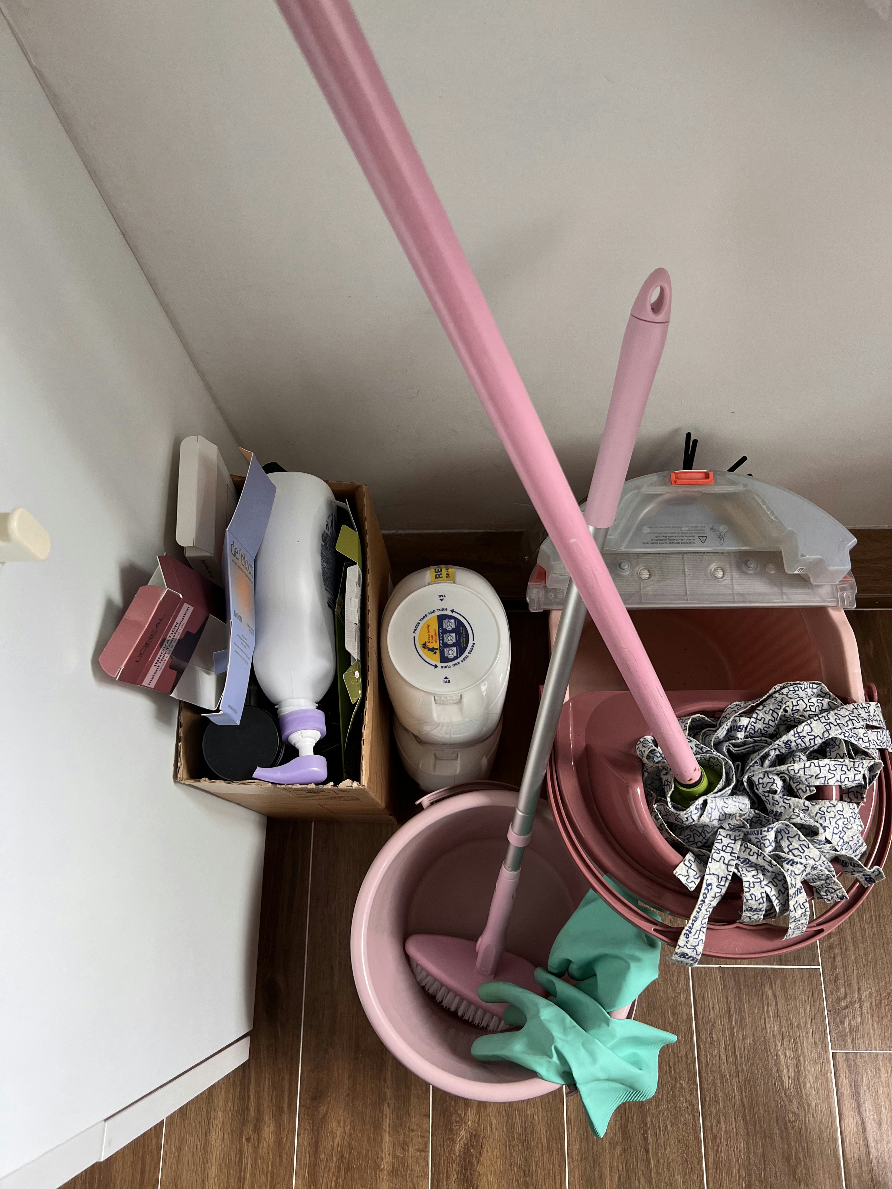 4Rm HDB Classic Farmhouse Open Concept Service Yard - Pink mop bucket, green rubber gloves, wooden floor, white wall, pink