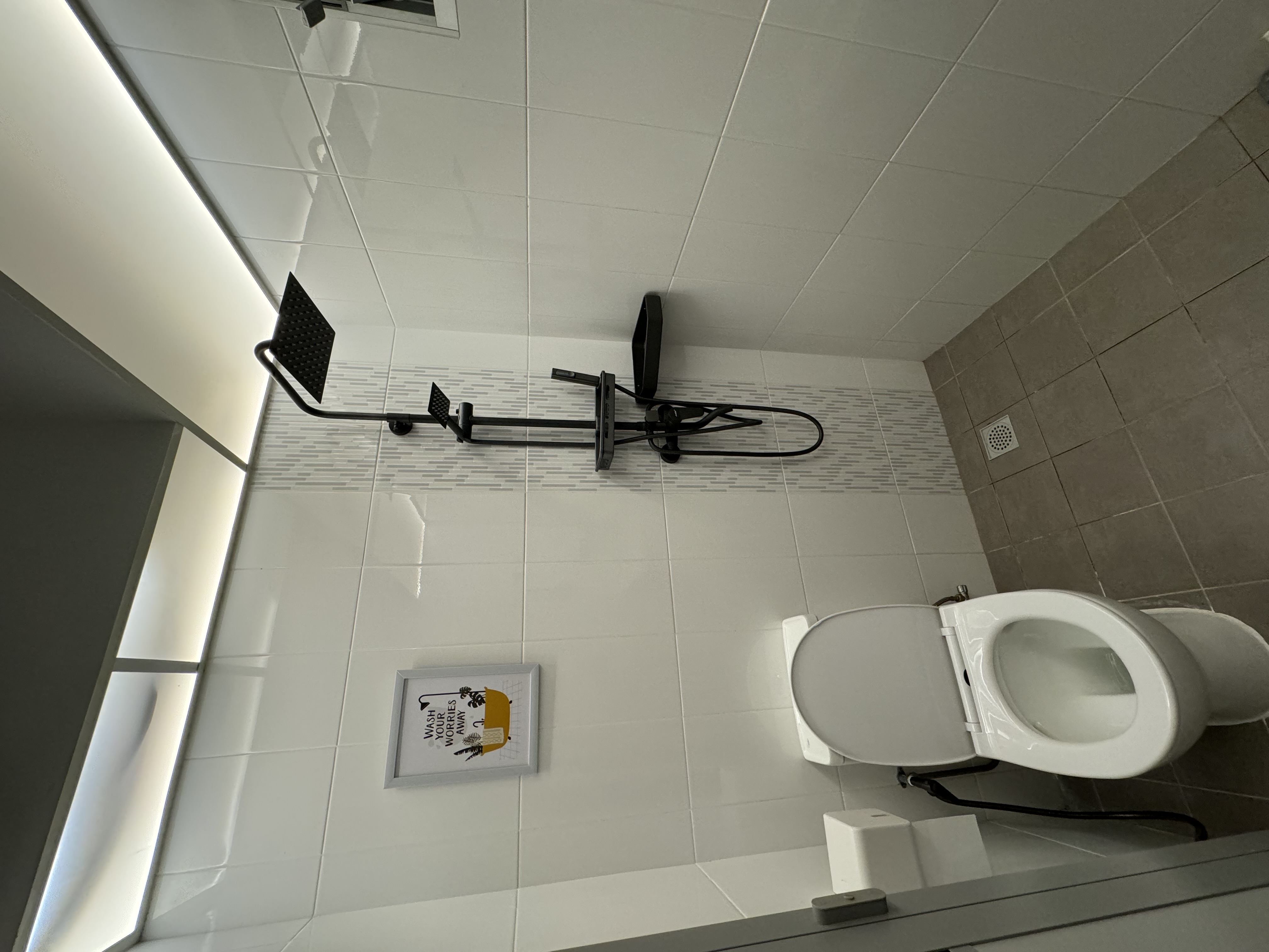 Transforming Our Bathrooms: LED Vibes with minimal budget - White tiled walls, modern bathroom, black shower rack, toilet