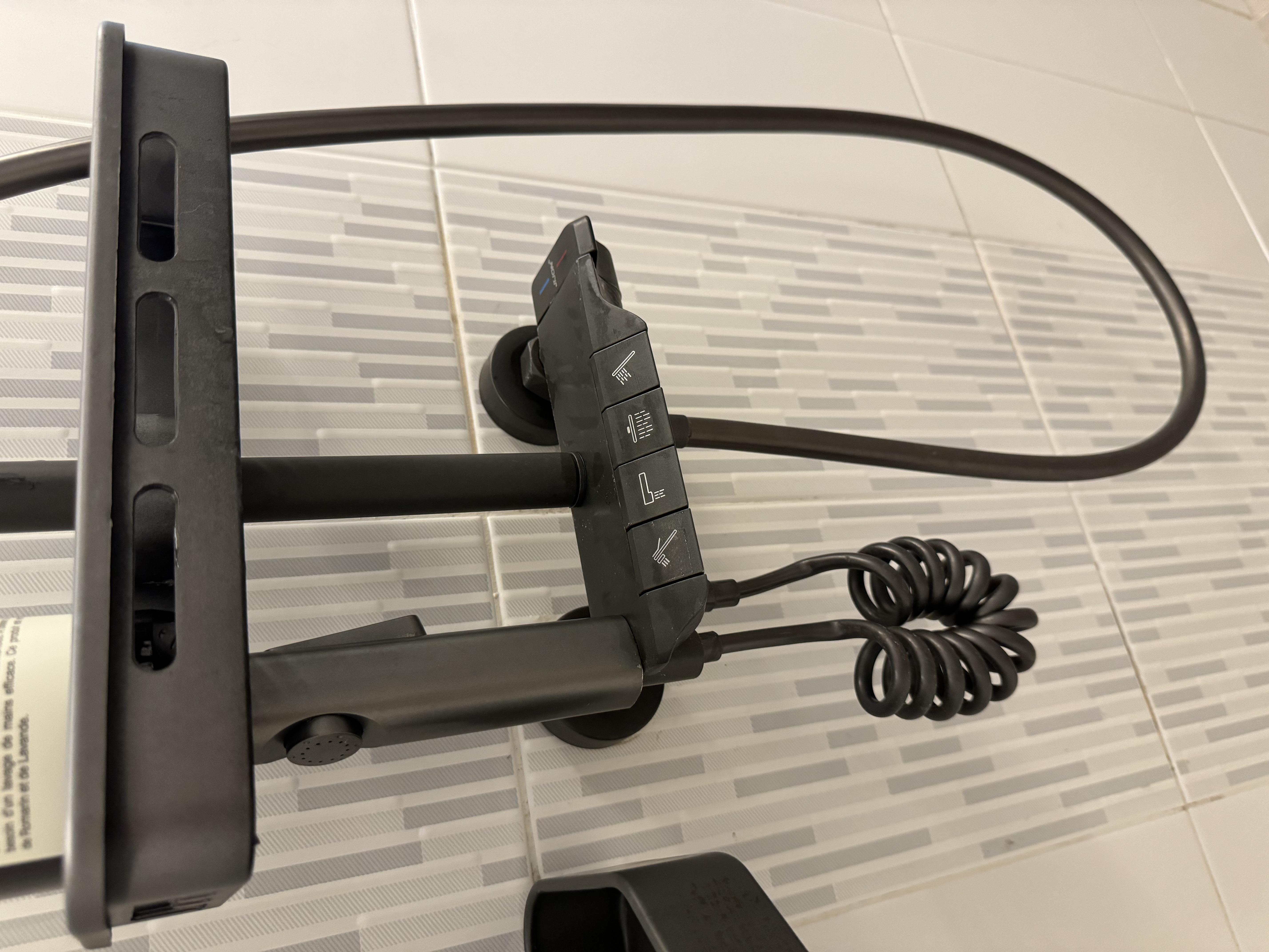 Transforming Our Bathrooms: LED Vibes with minimal budget - Black exercise bike, black handlebars, black pedals, black foot