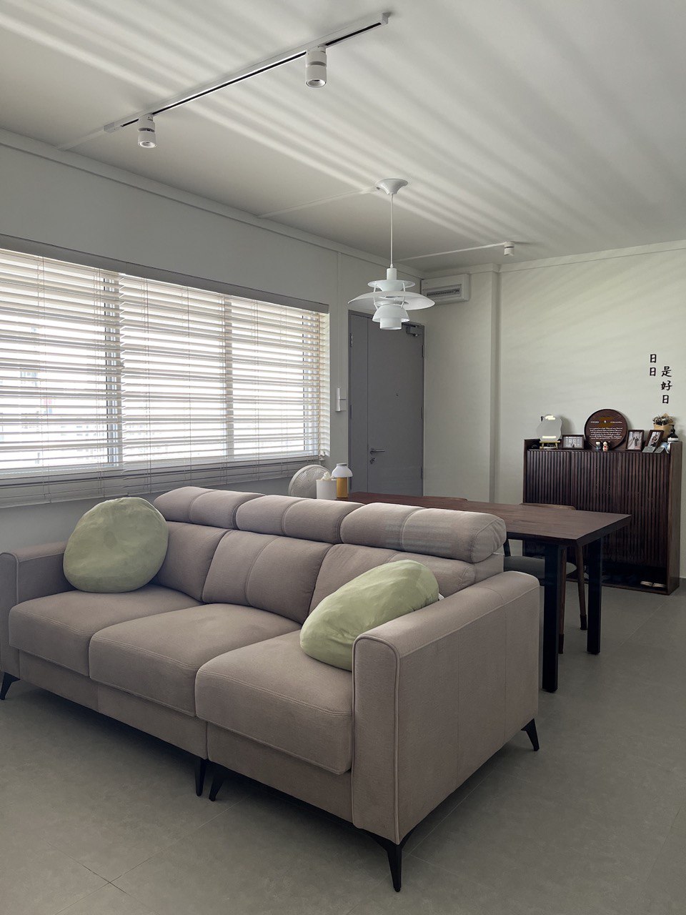 Coziness with a splash of wood and clean lines | Mid-Century Reno <70K - Modern living room with beige sectional sofa, green