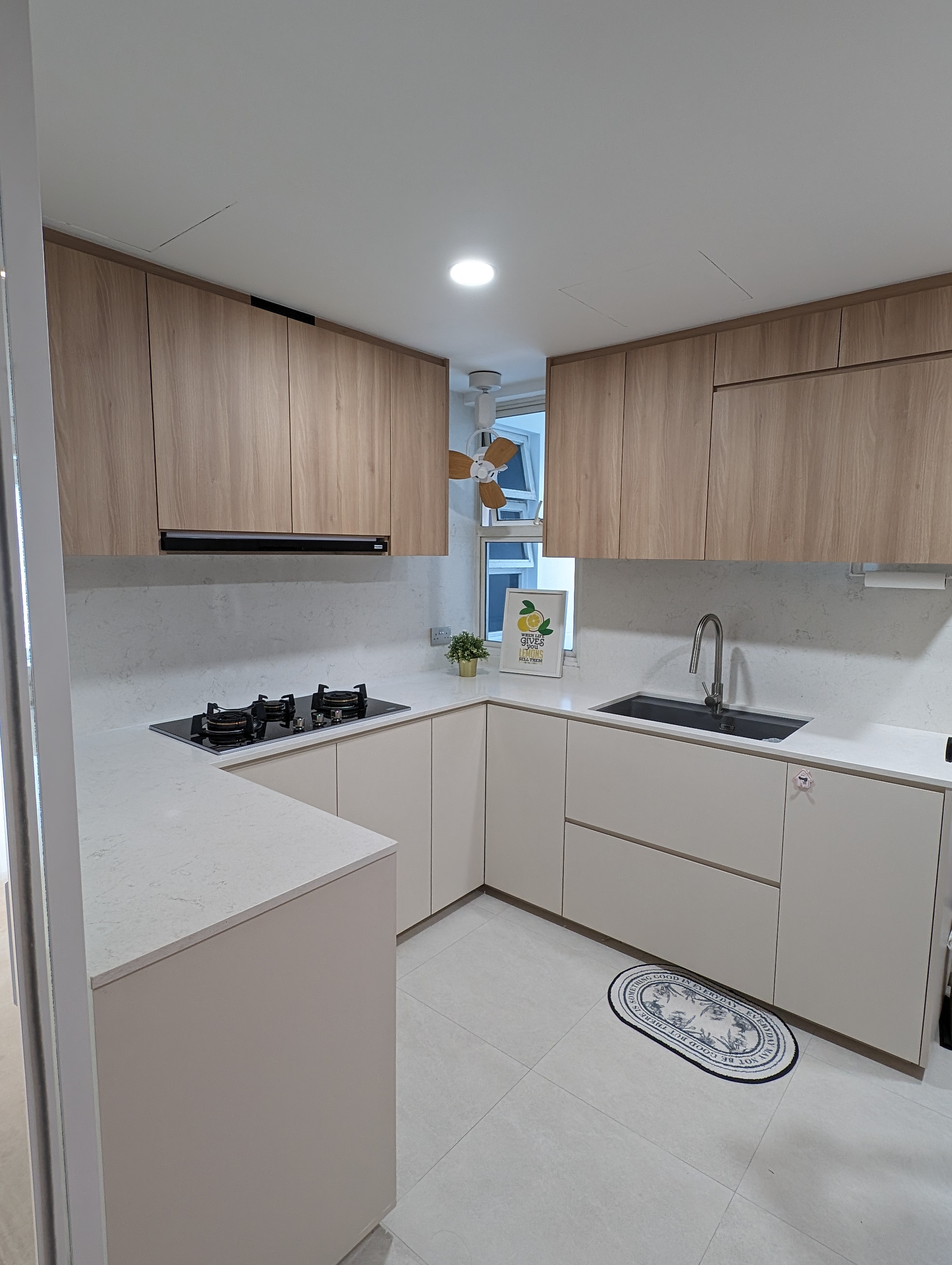 Keeping it timeless and clutter-free in this 4BR condo! - Wooden cabinets, modern kitchen, light beige countertops, black