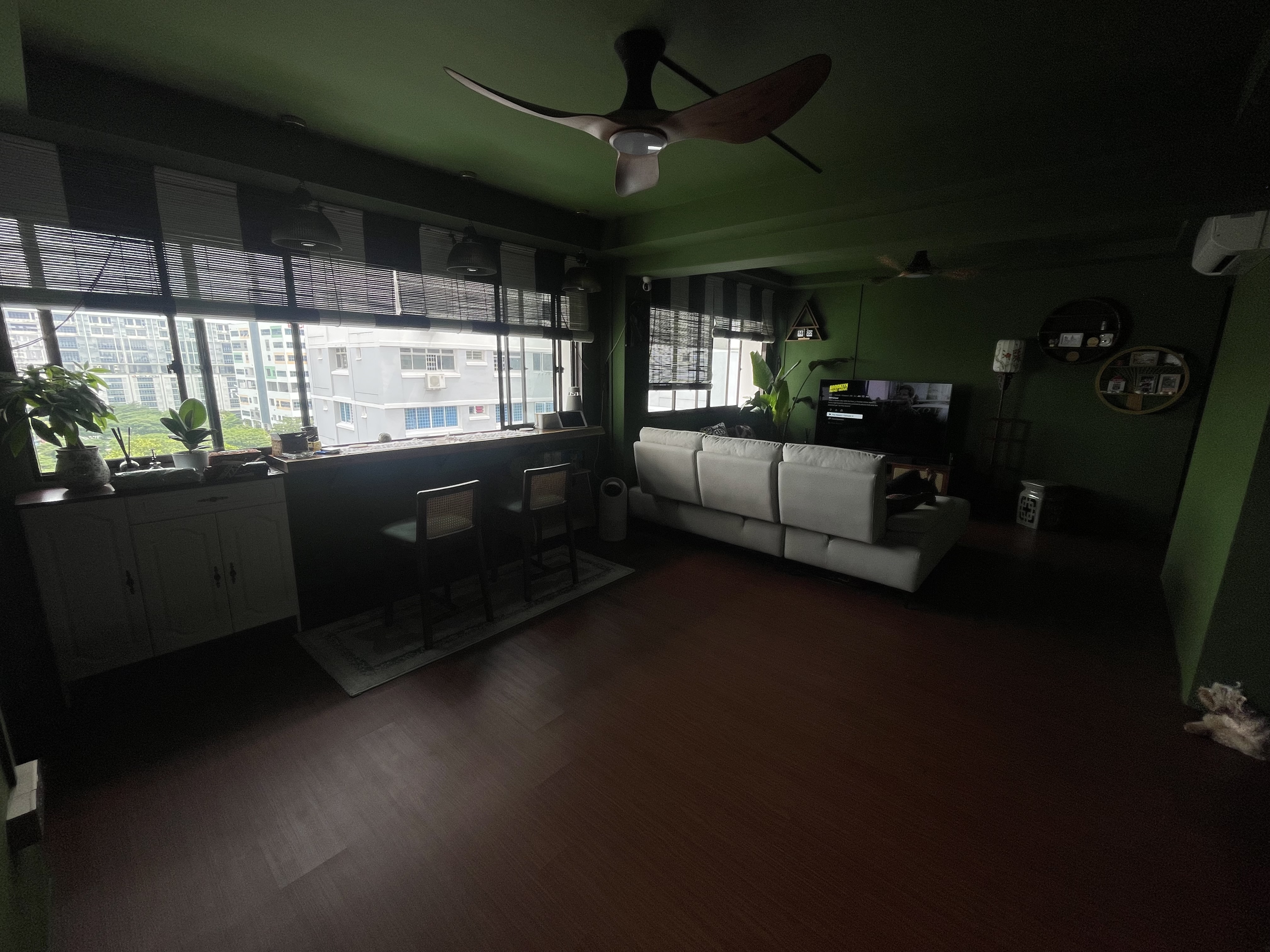 A unique blend of mid-century charm & cottage coziness - Green living room, modern decor, large windows, indoor plants, white