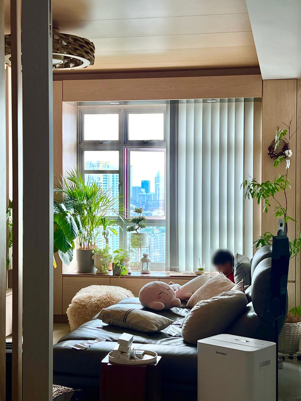 "Embracing the Magic: Day and Night Views from Our Nest ✨🌙" - Modern living room, cozy seating area, large window, cityscape