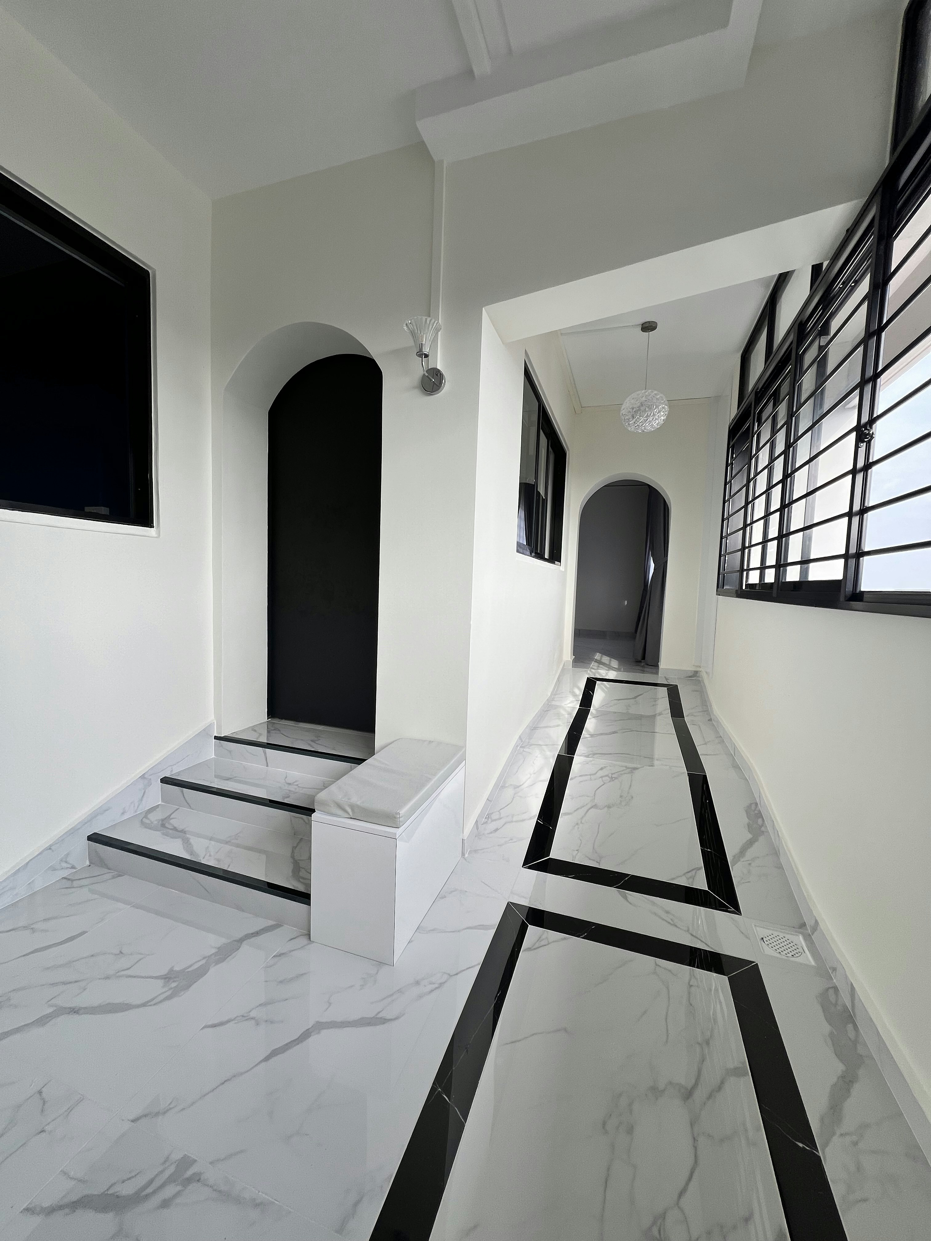 Welcome to our newly renovated 30 ish year old HDB jumbo! - Modern minimalist hallway, sleek white walls, black accents