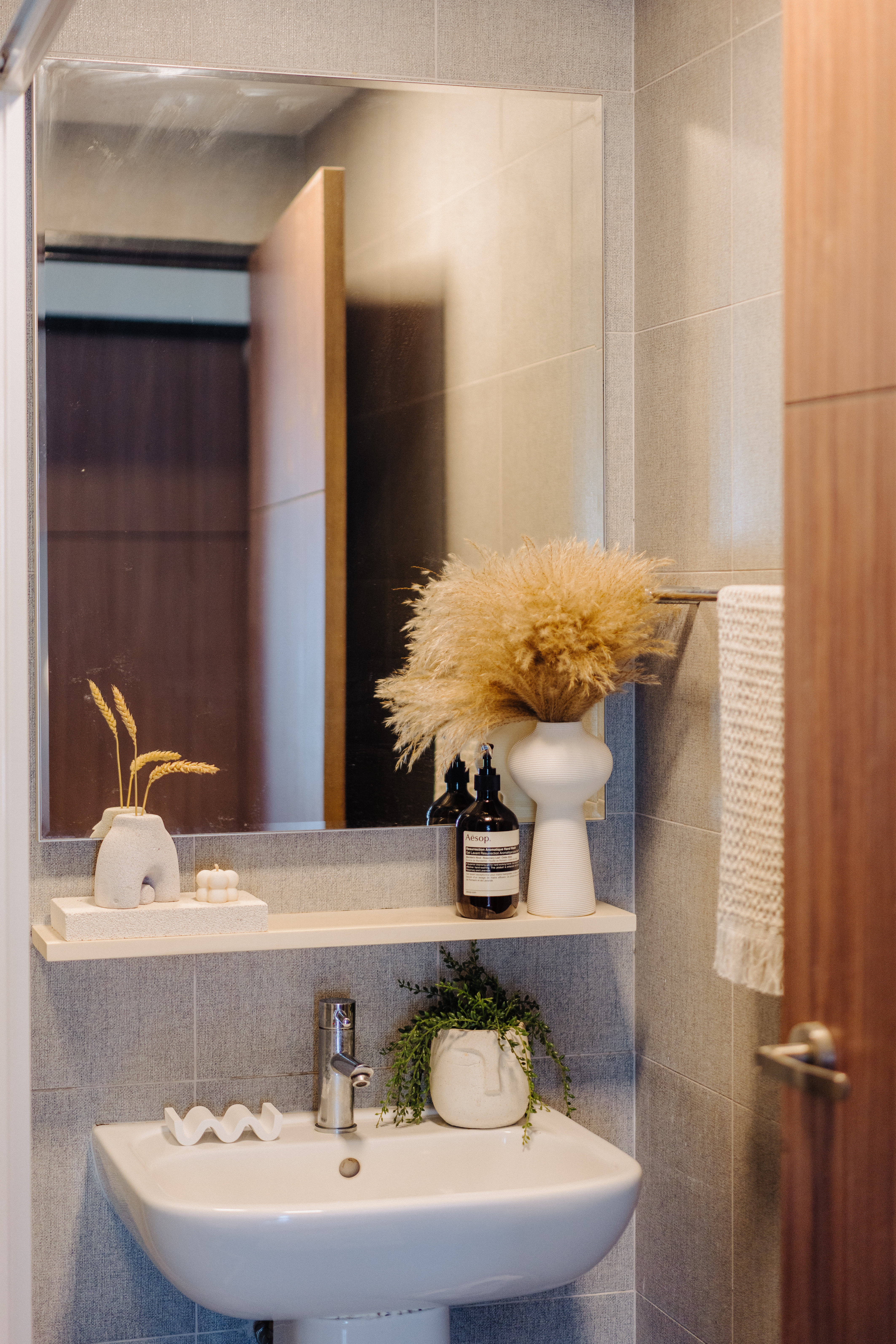 Photographer/Videographer couple’s cosy styled DBSS home in Yishun - modern bathroom vanity, white sink, gray tiles, mirror