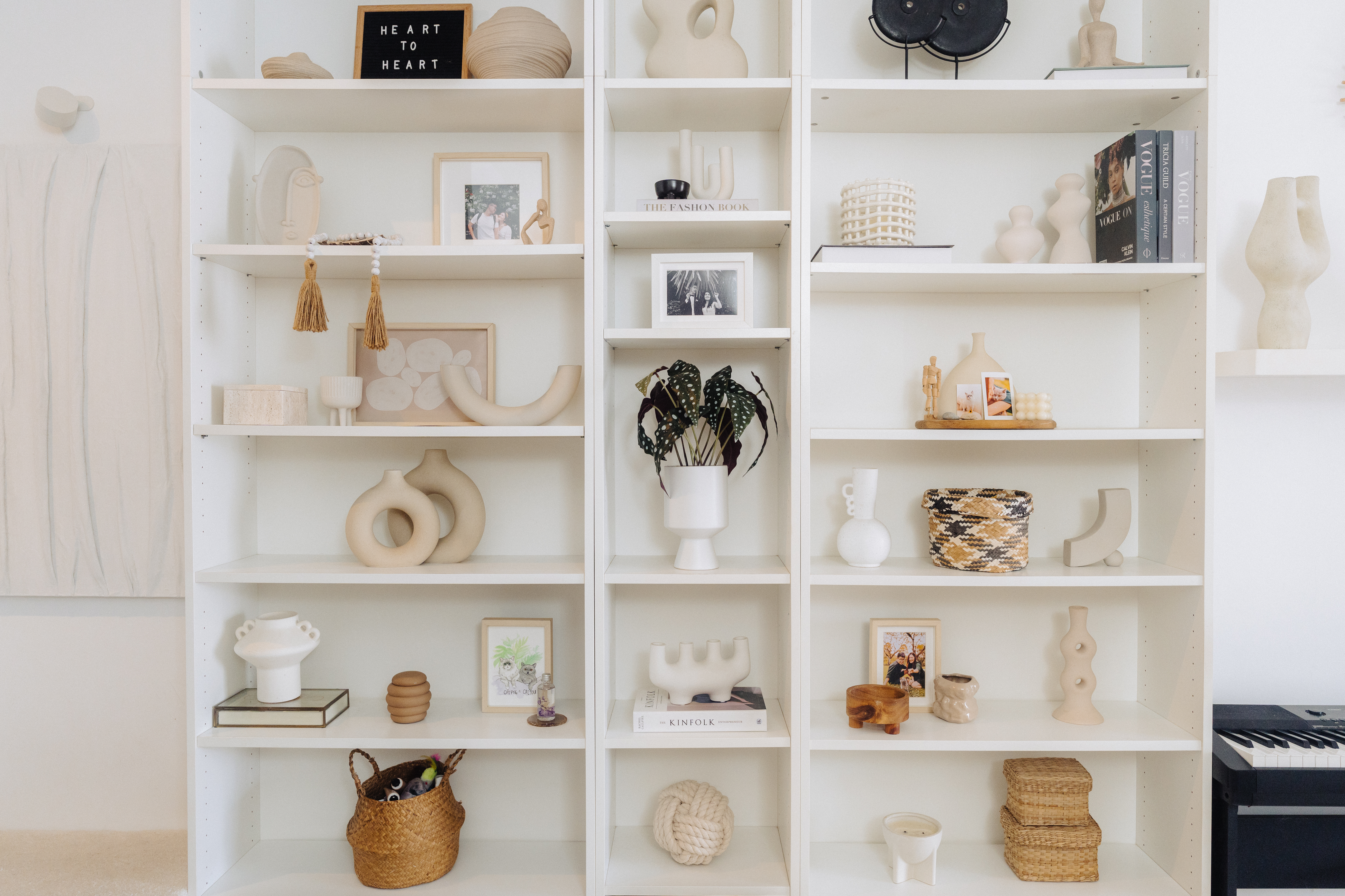 Photographer/Videographer couple’s cosy styled DBSS home in Yishun - White shelving unit, minimalist decor, modern art