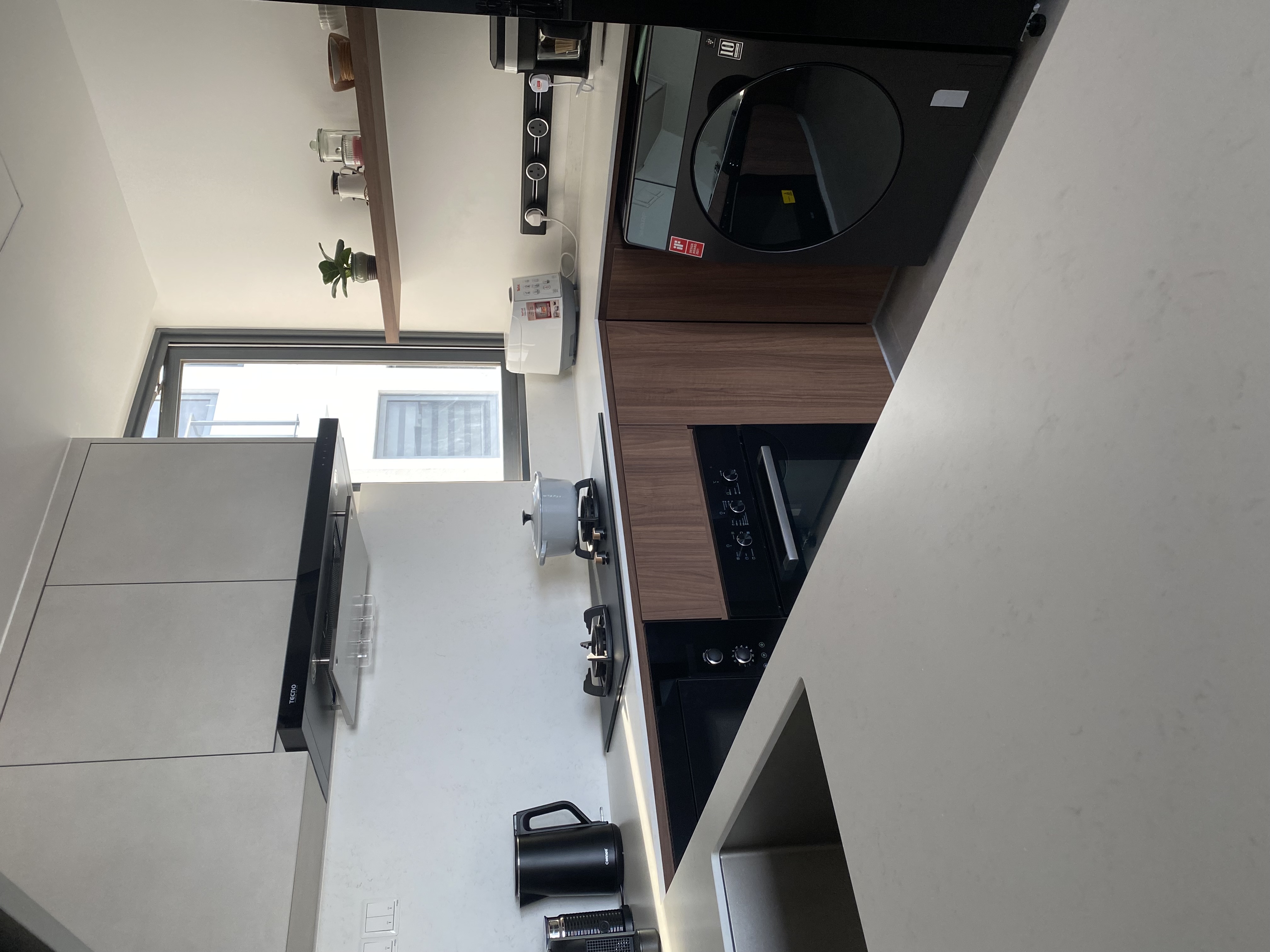 A-home-gallery-and-library-in-dark-wood-and-grey-tones