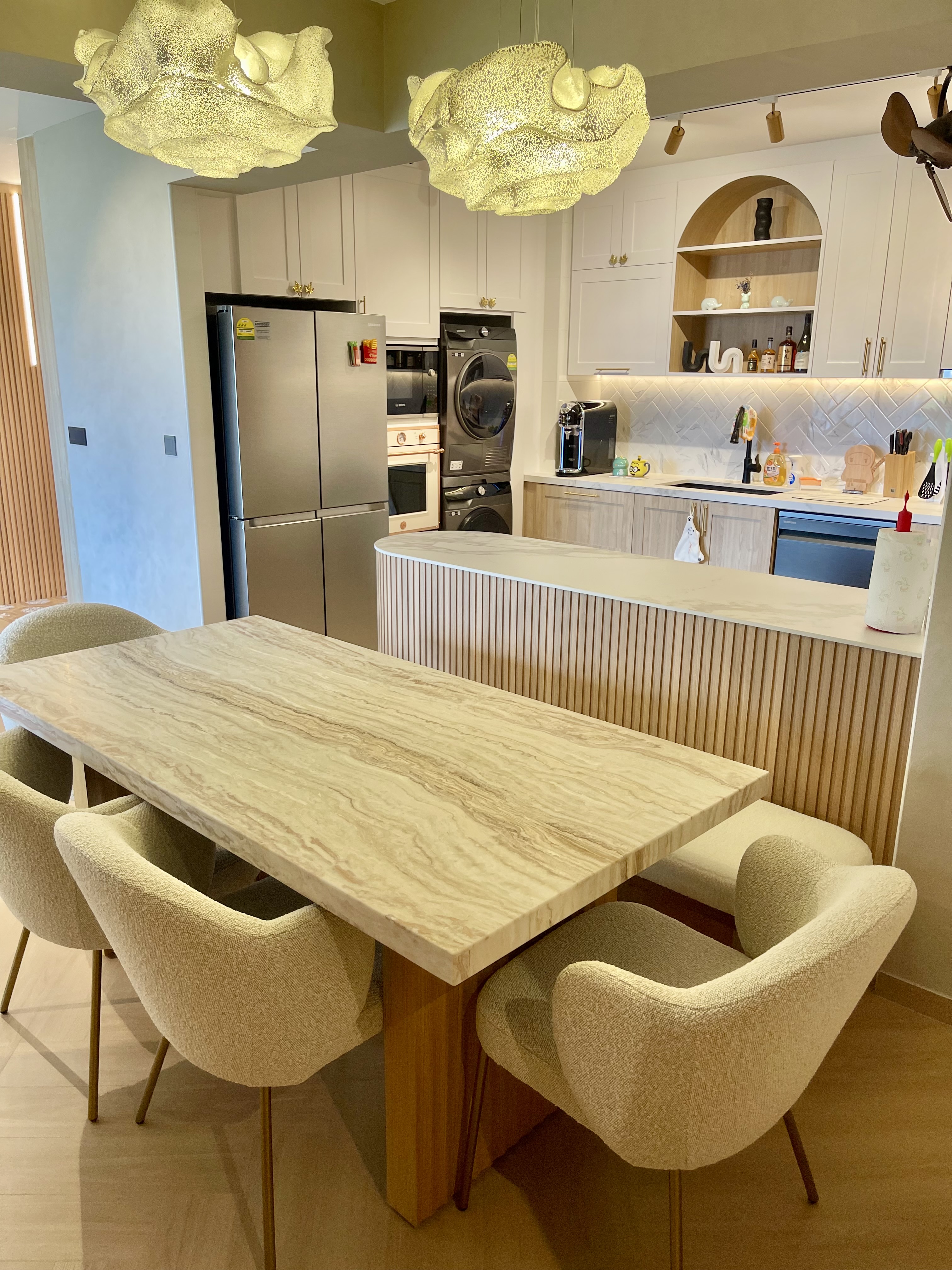 A Self-designed Cosy Abode at Woodleigh Hillside - Modern kitchen with marble dining table and beige upholstered chairs