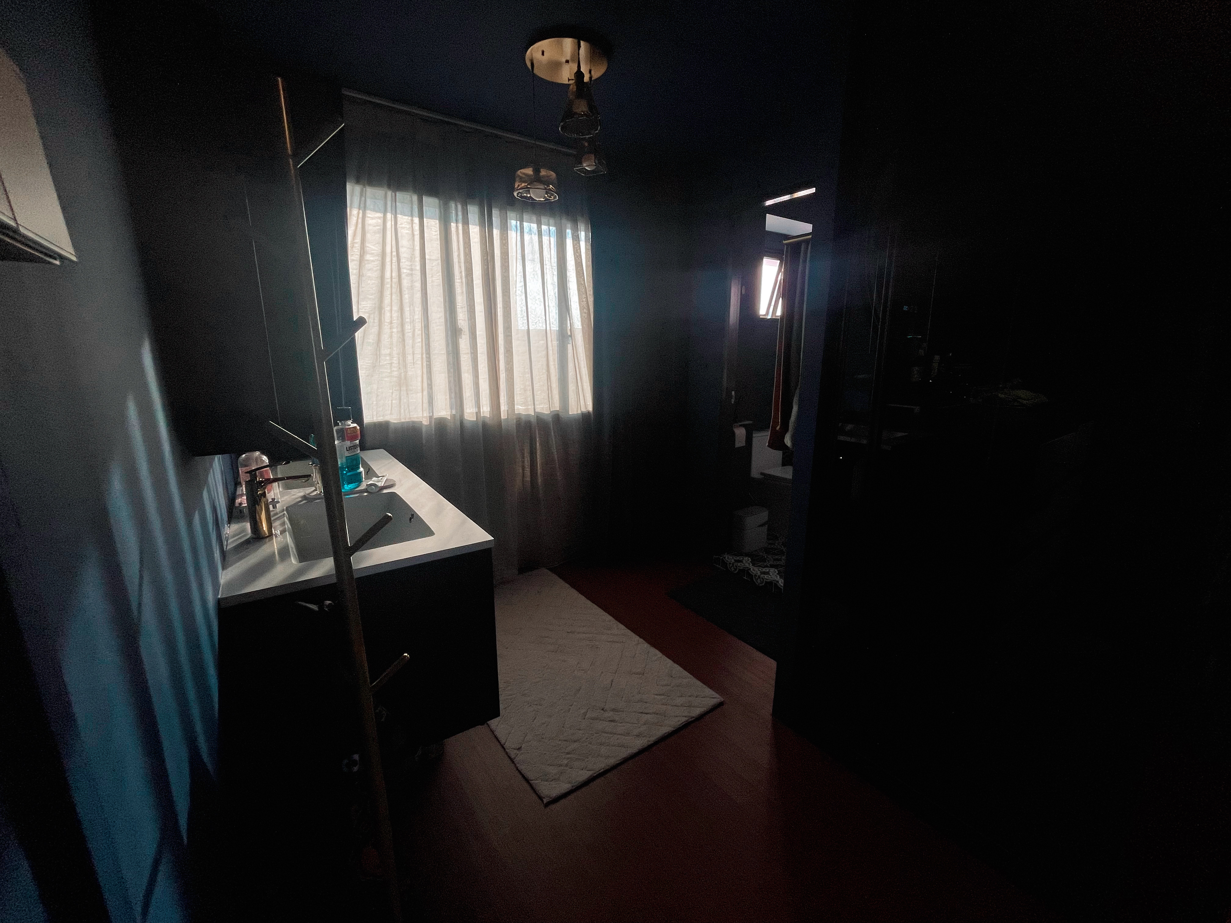 A unique blend of mid-century charm & cottage coziness - Bathroom, sink, vanity, mirror, light fixture, natural light