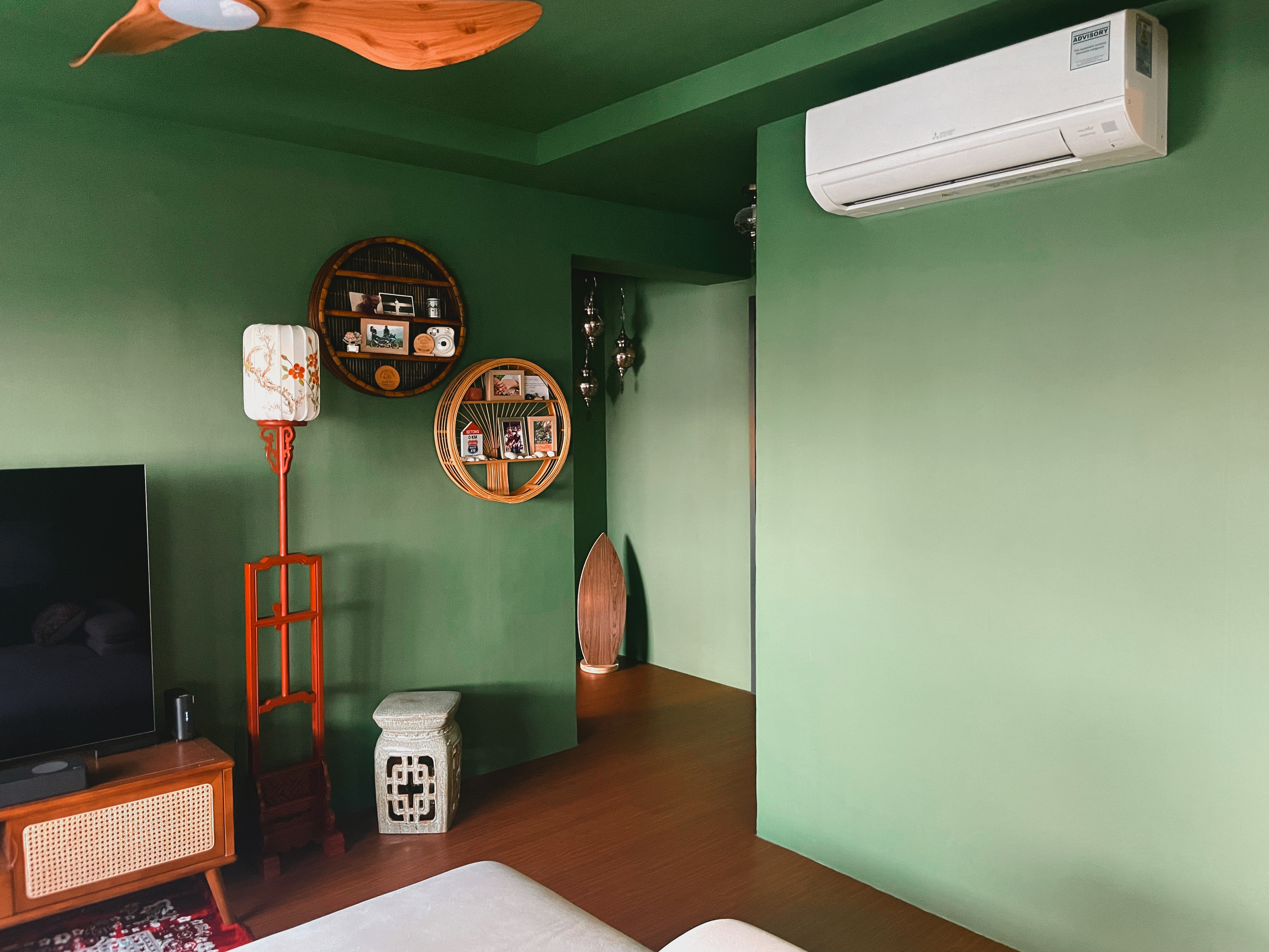 A unique blend of mid-century charm & cottage coziness - Green walls, modern decor, wooden furniture, TV stand, decorative