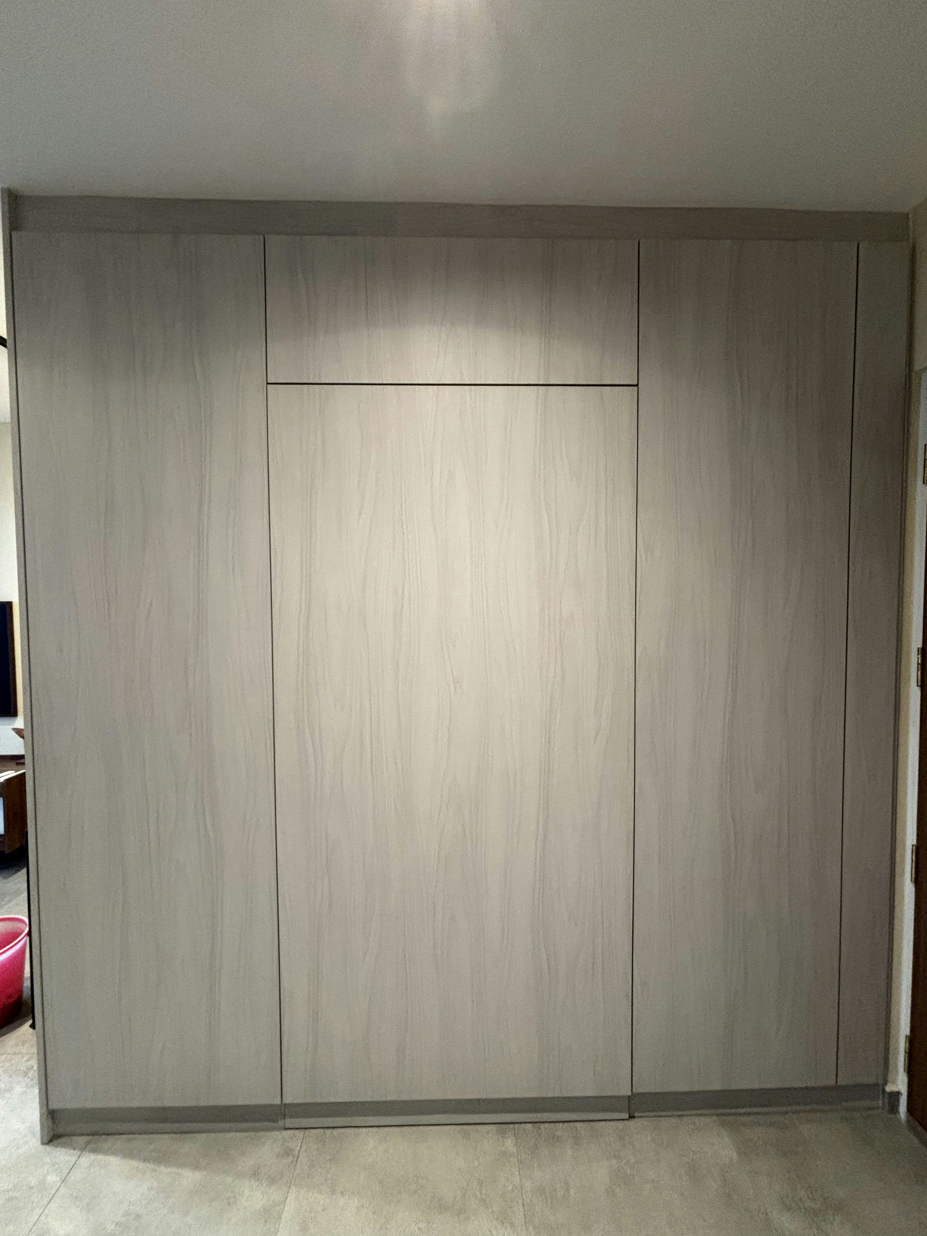 Inside a practical Modern Mediterranean 4RM BTO - Wooden wardrobe with clean lines, light gray color, minimalist design