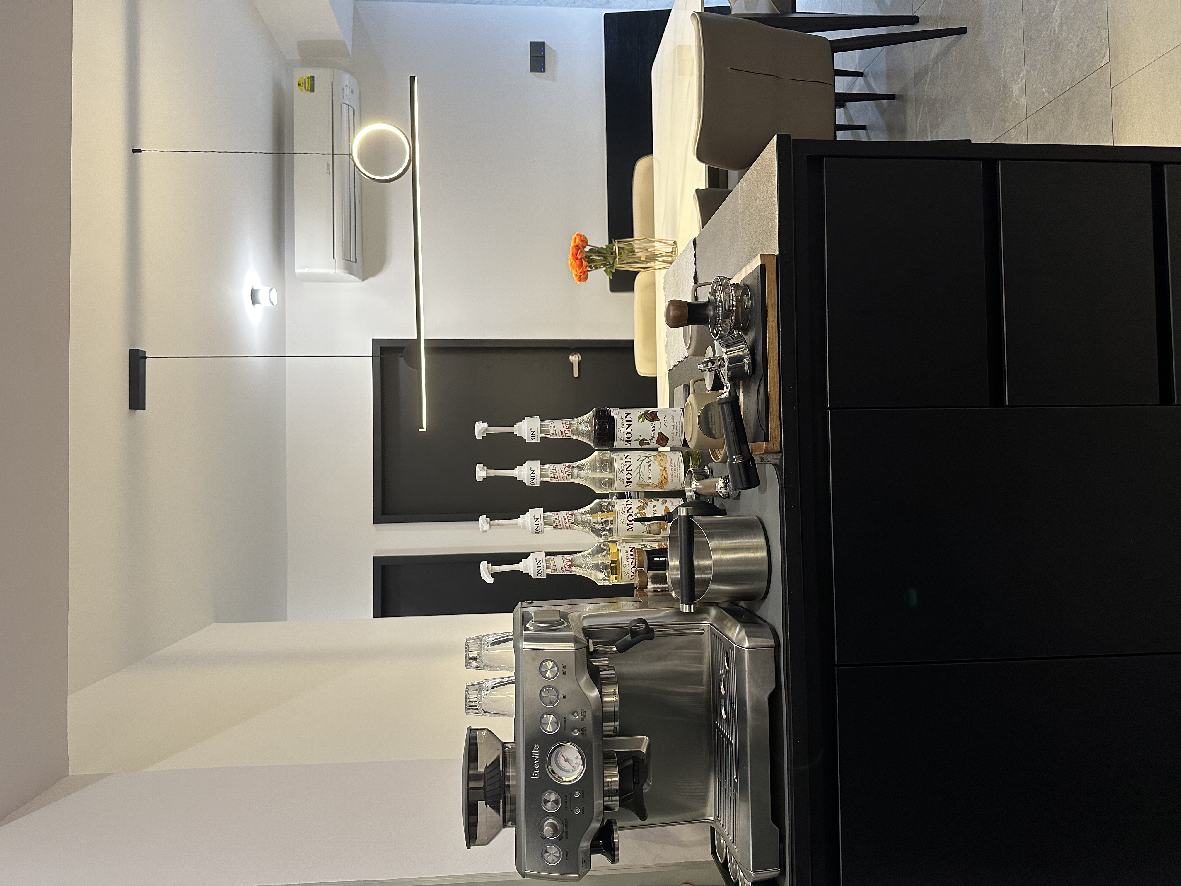 Elegance Redefined with Dark Contemporary Theme - $37K Renovation  - Modern kitchen with sleek appliances, minimalist design