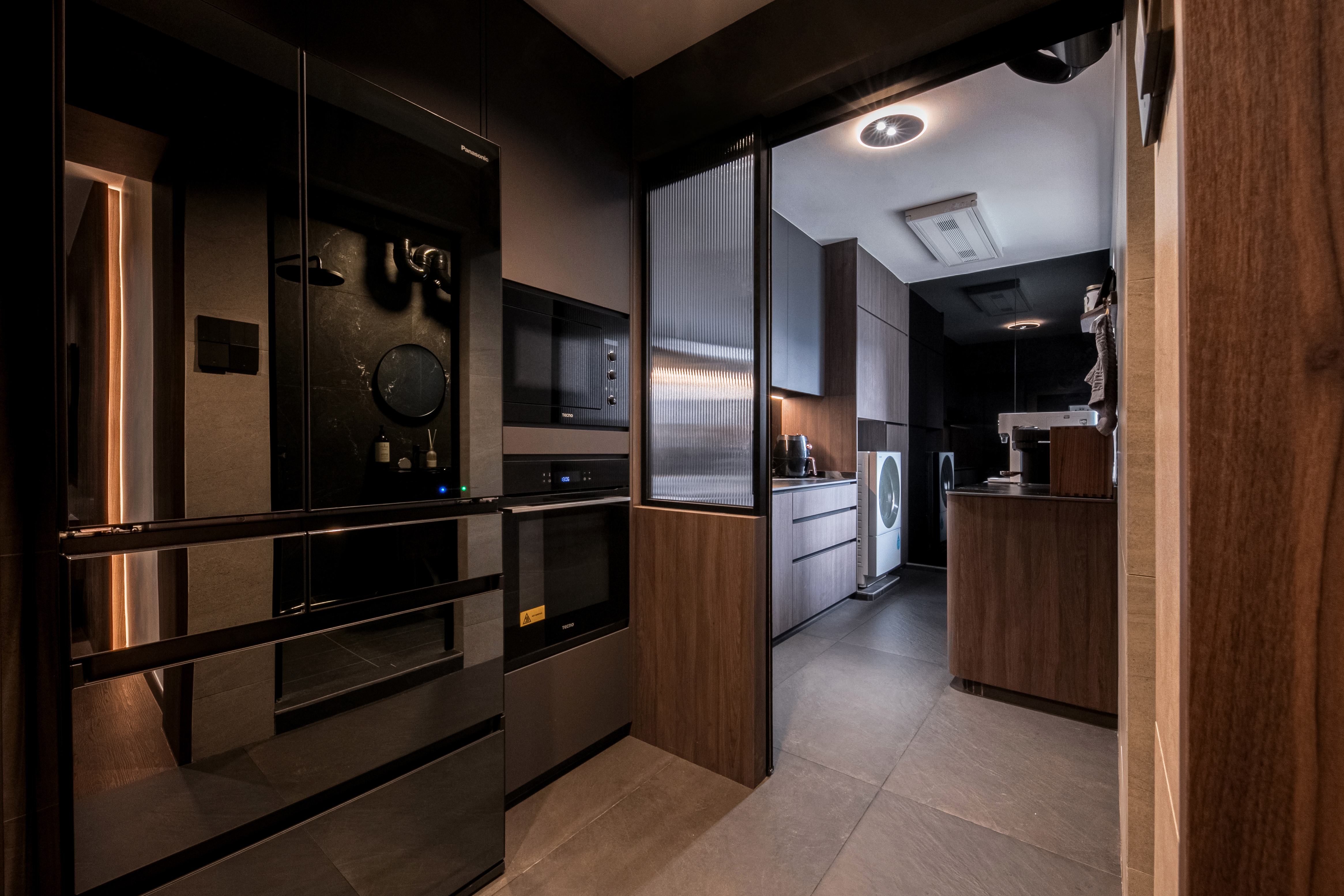 $120K Renovation for a Cozy & Warm Home - Modern kitchen with sleek appliances, dark wood cabinets, stainless steel