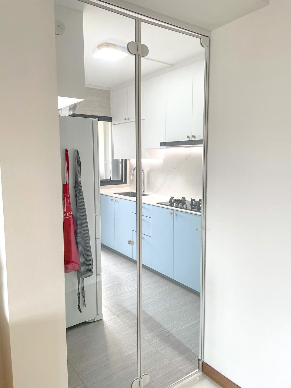 A Japandi Home with a Blue Heart under $30k - Glass door kitchen, modern design, light blue cabinets, stainless steel