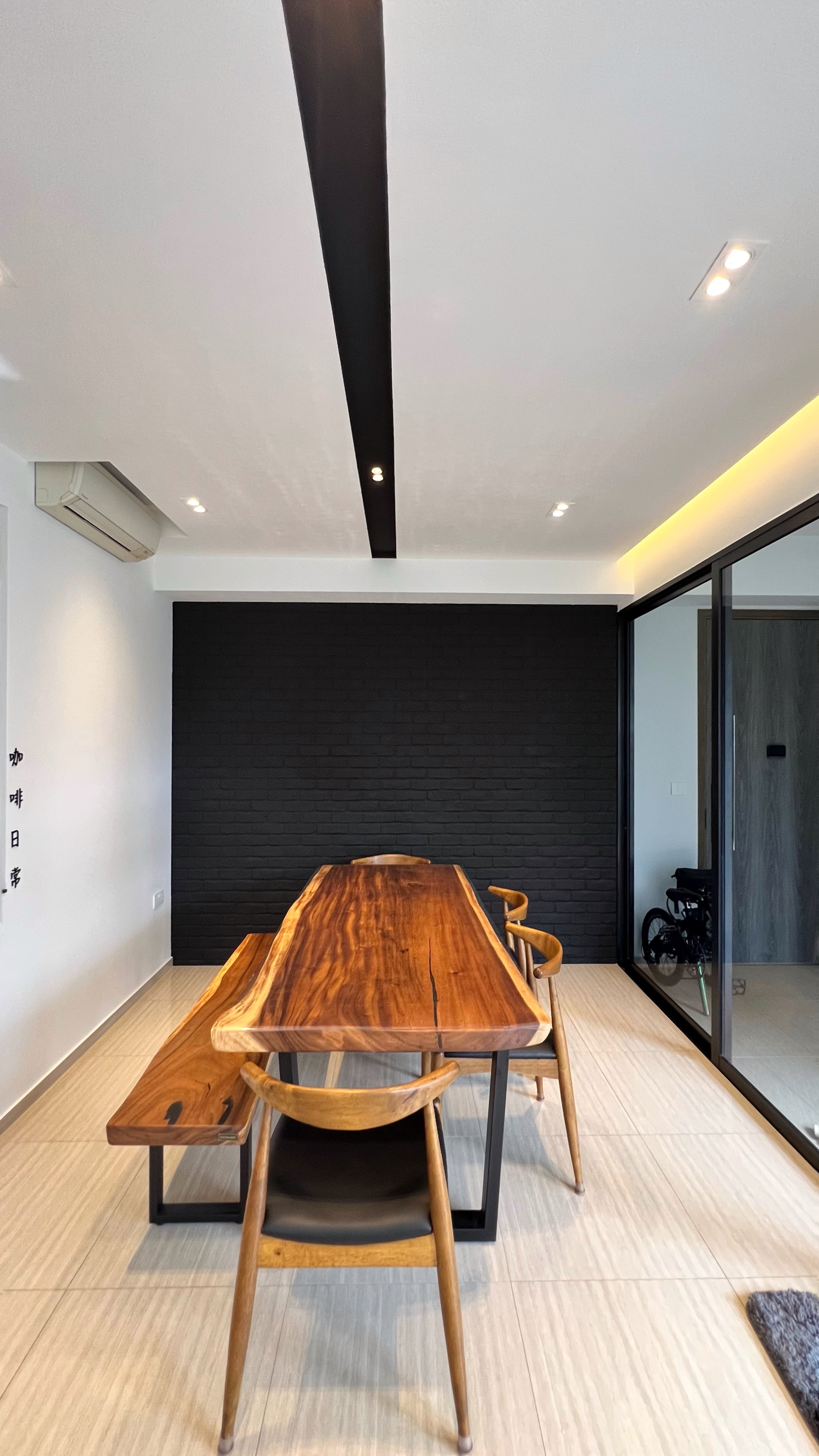 Our little cosmopolitan treehouse! - Wooden dining table, minimalist design, modern interior, sleek black wall, contemporary