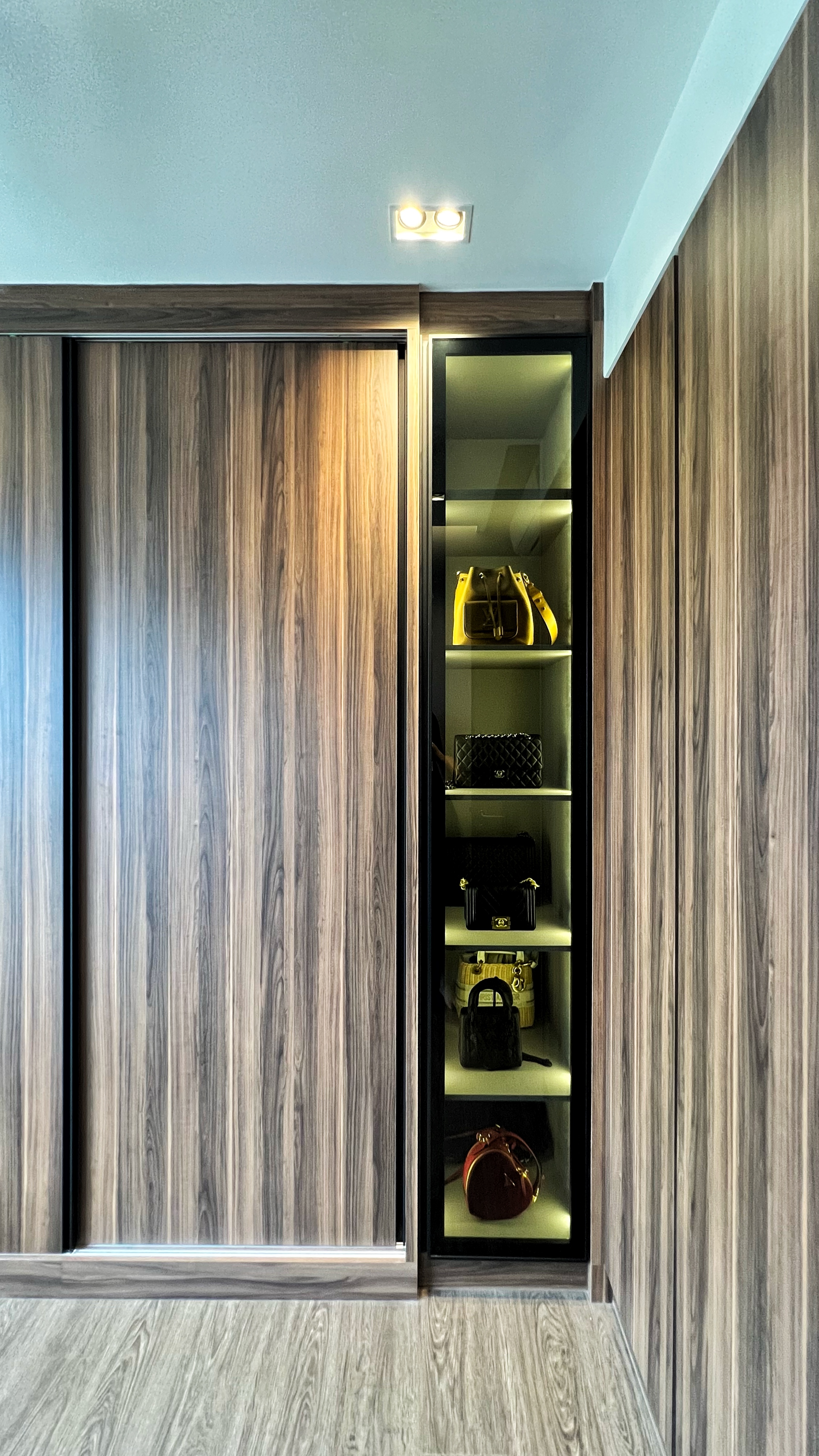 Our little cosmopolitan treehouse! - Wooden wardrobe with glass doors, sleek design, modern aesthetic, stylish interior