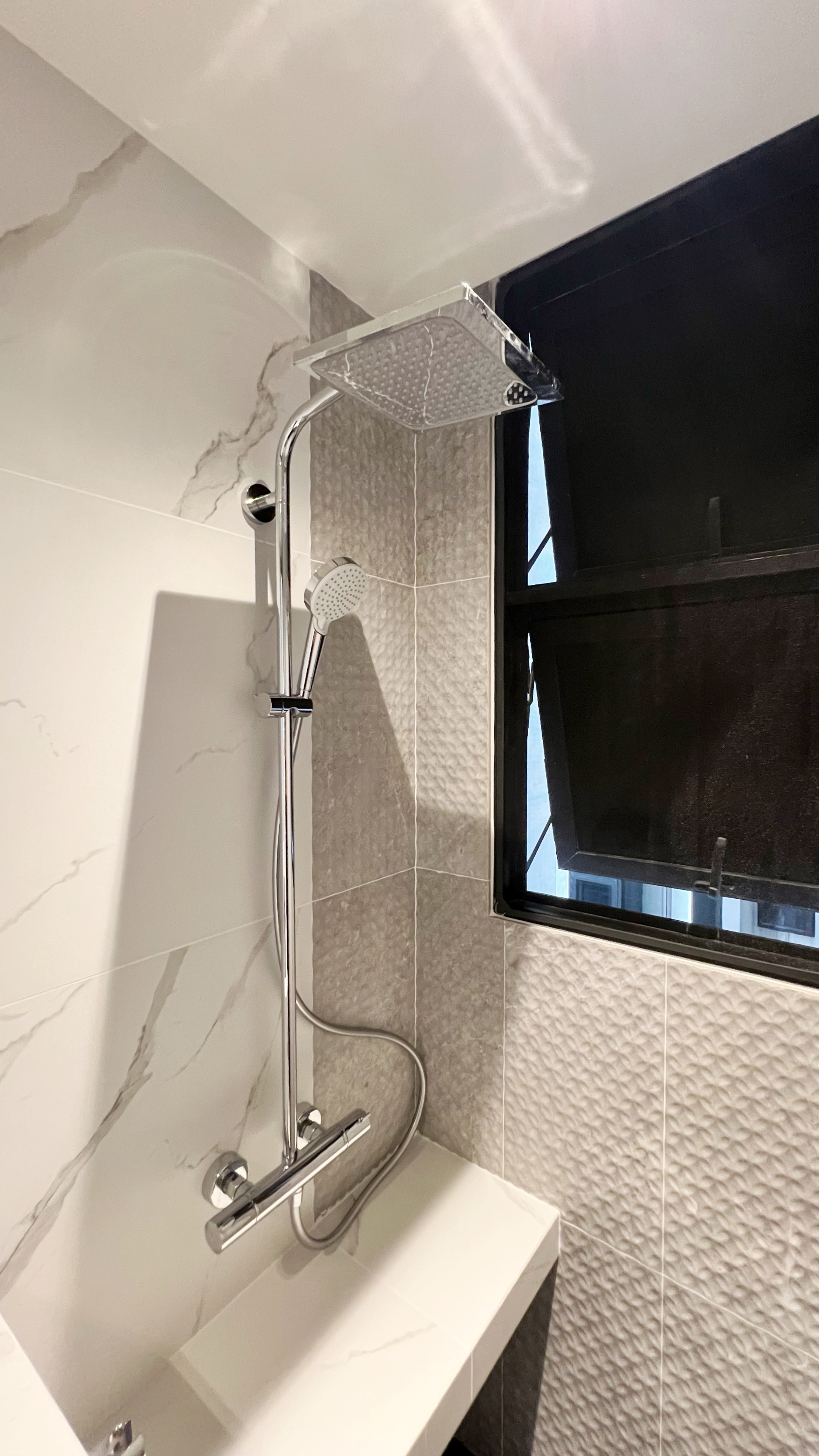 Our little cosmopolitan treehouse! - Modern bathroom, sleek design, contemporary fixtures, high-tech showerhead, tiled walls