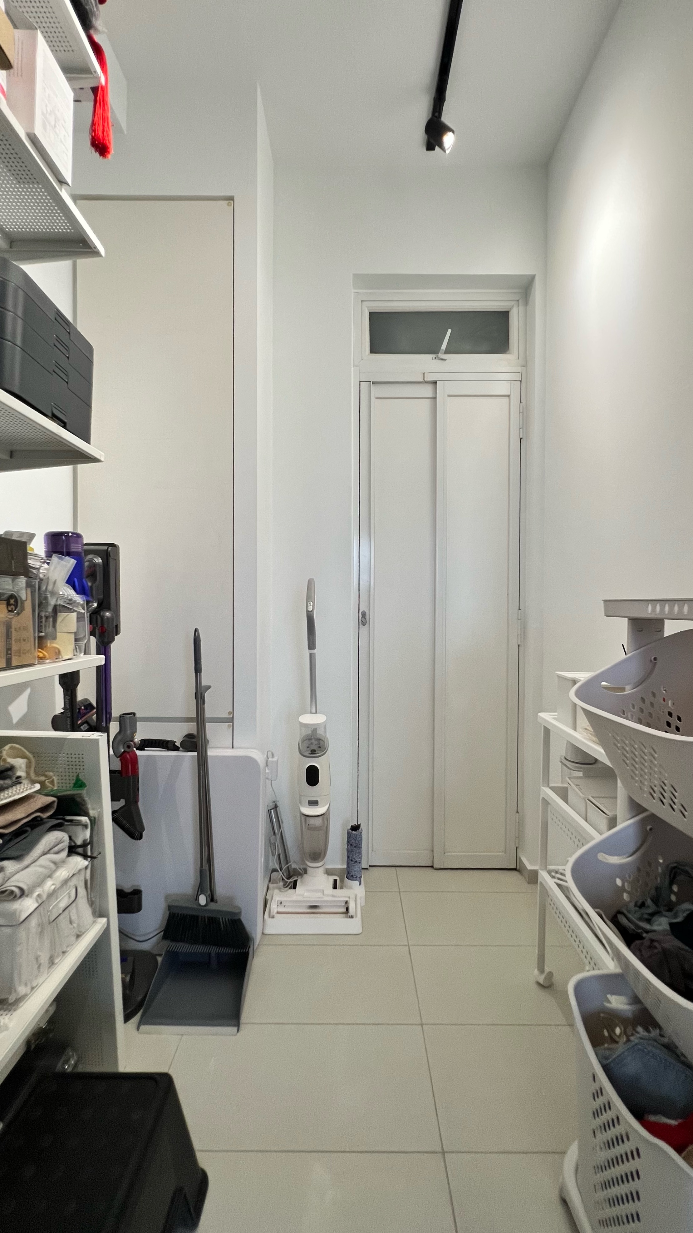 Our little cosmopolitan treehouse! - Storage room, white walls, white door, white shelves, broom, dustpan, vacuum cleaner