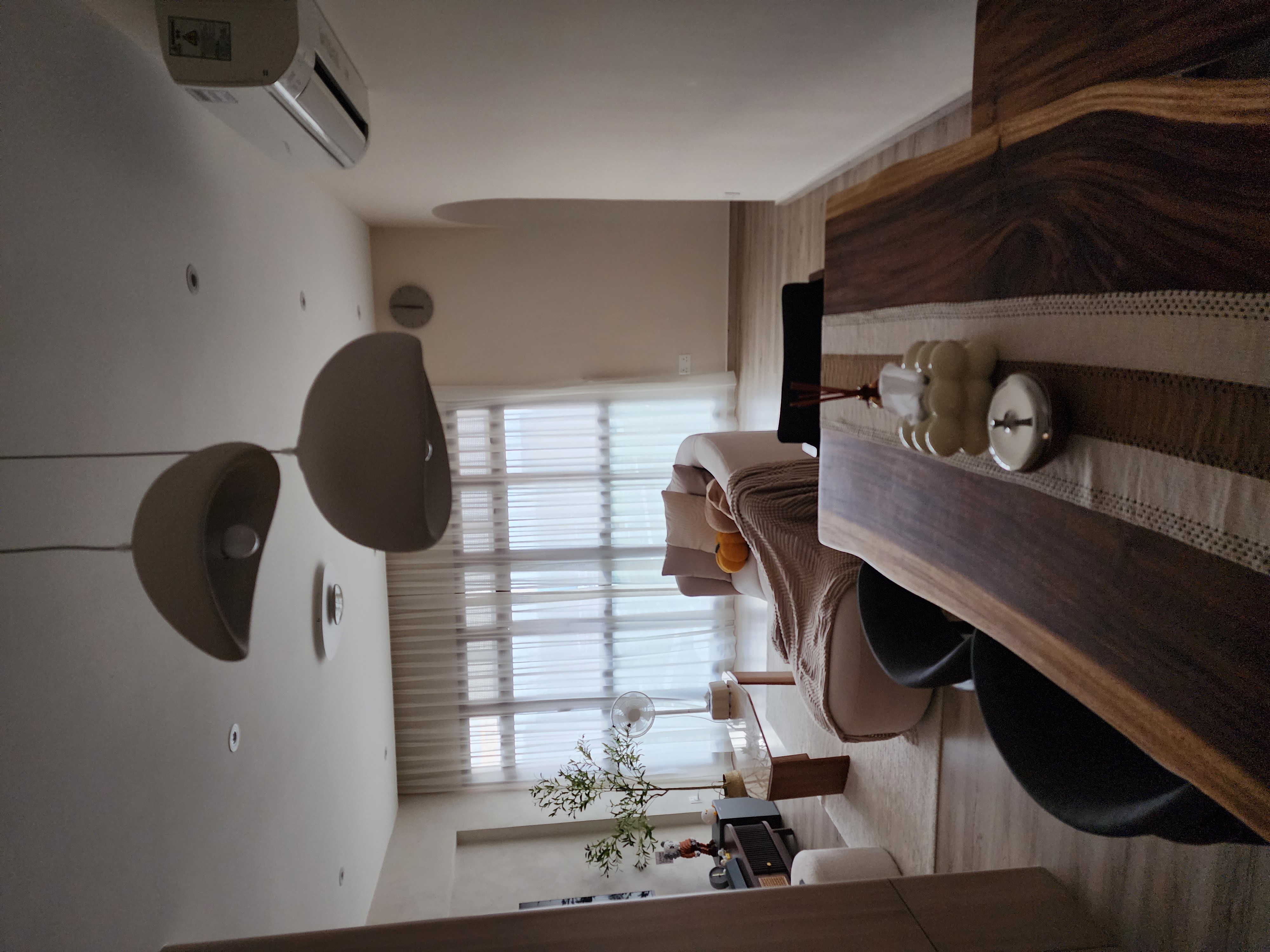 Inside our 1076sqft scandinavian neutral home - Modern minimalist living room, cozy seating area, soft natural light, large