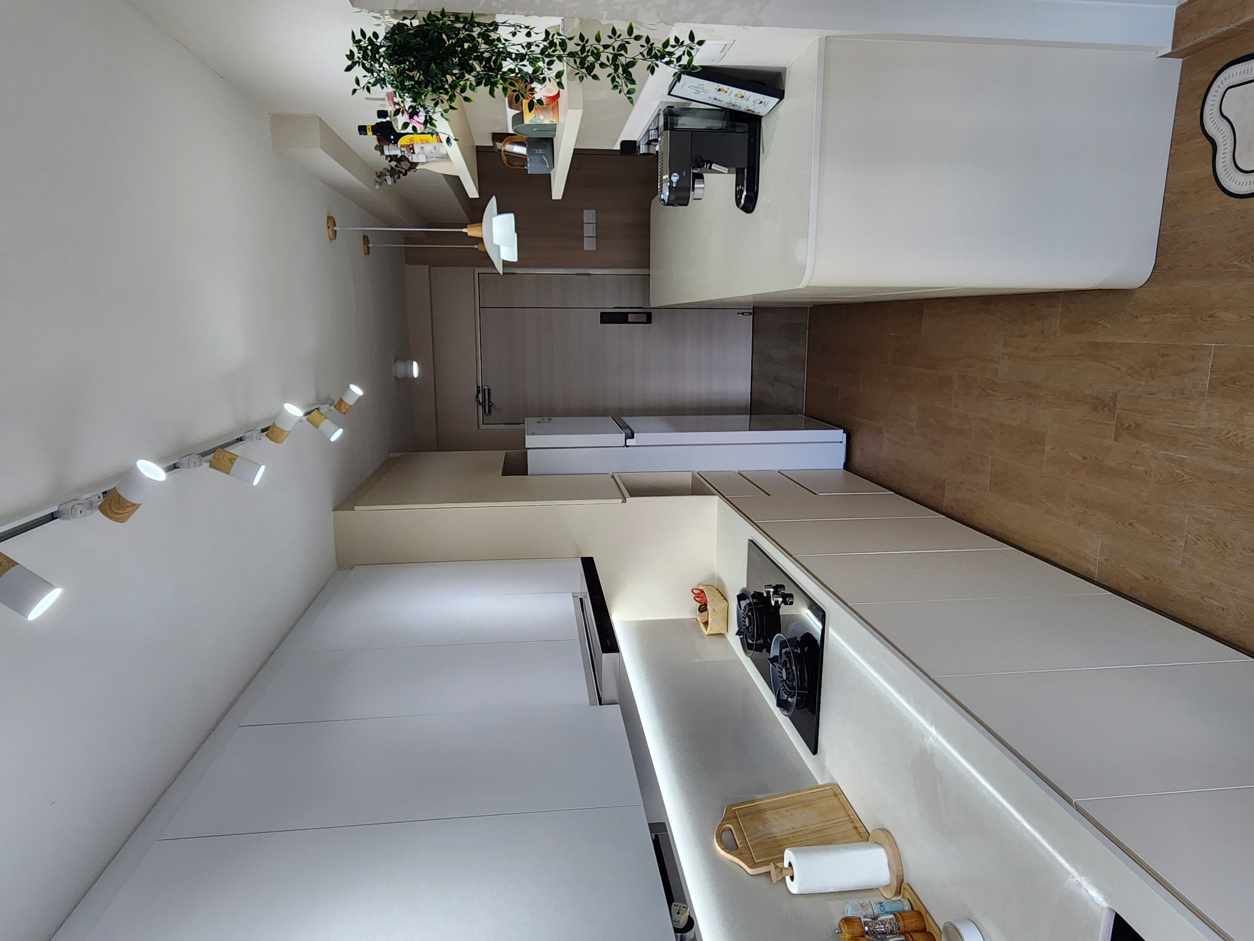 Inside our 1076sqft scandinavian neutral home - Modern kitchen with sleek design, minimalist decor, integrated appliances