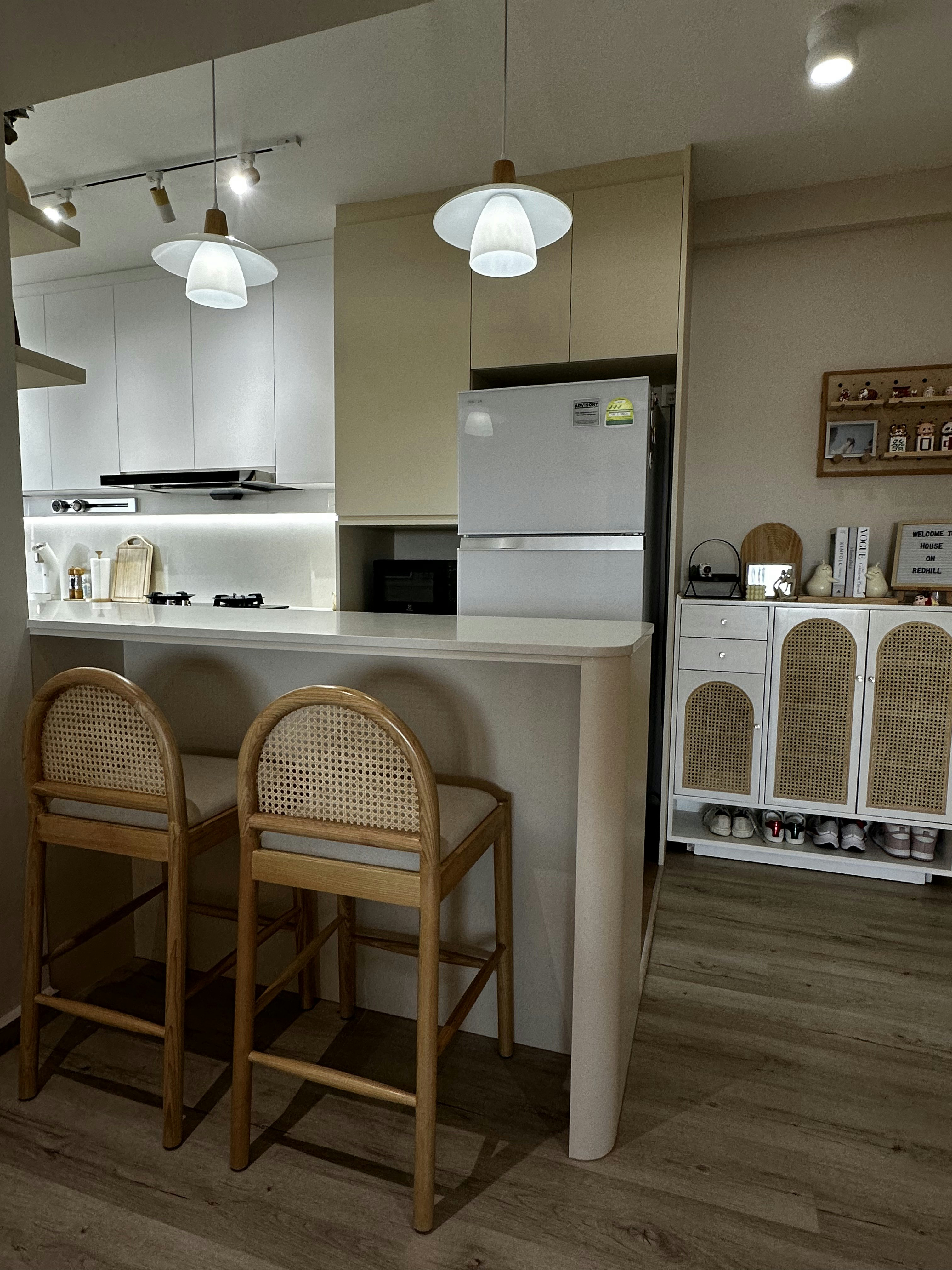 Inside our 1076sqft scandinavian neutral home - Modern kitchen with minimalist design, white cabinets, built-in appliances