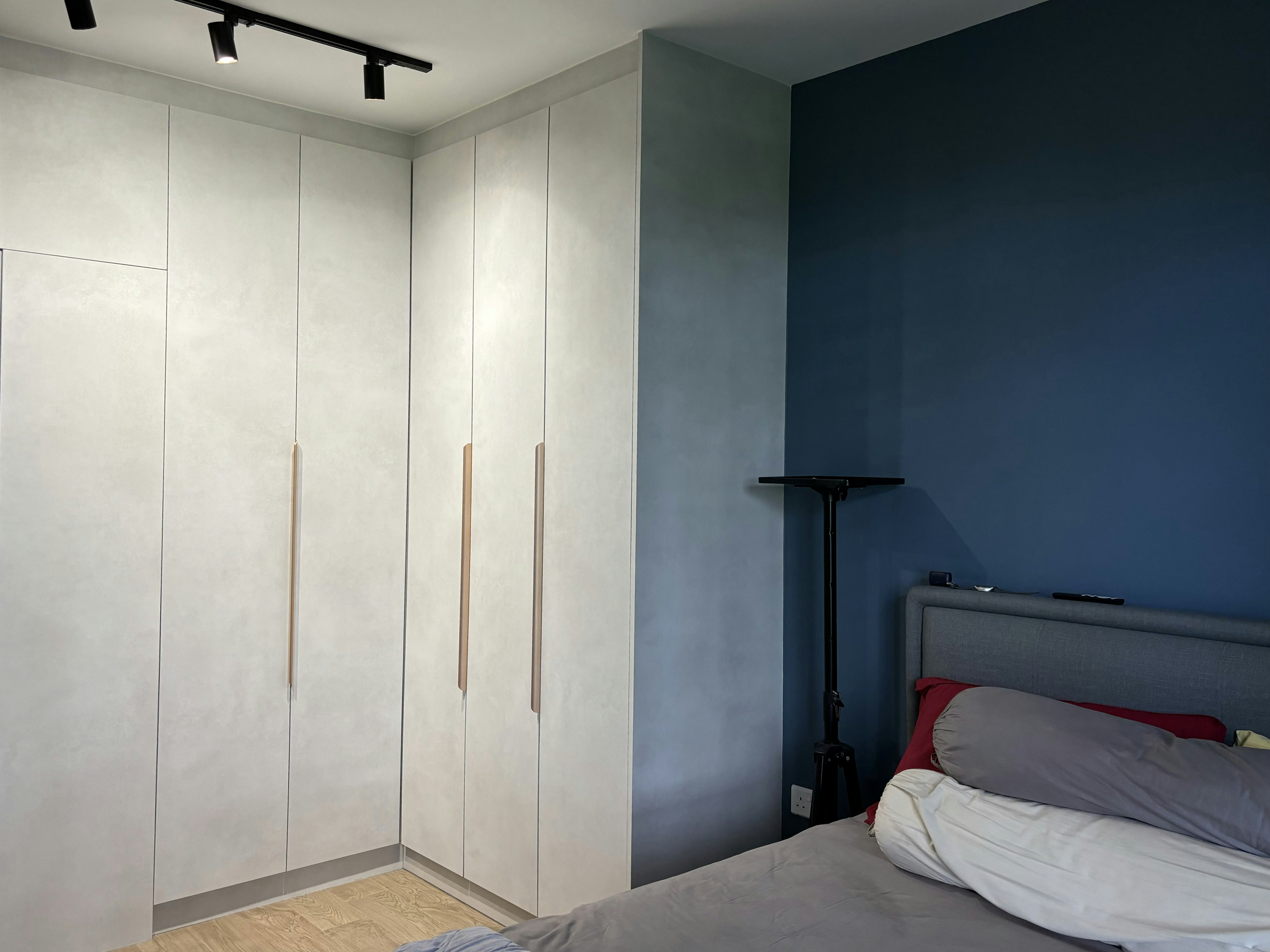 Inside a practical Modern Mediterranean 4RM BTO - Light gray wardrobe with vertical handles, minimalist design, modern