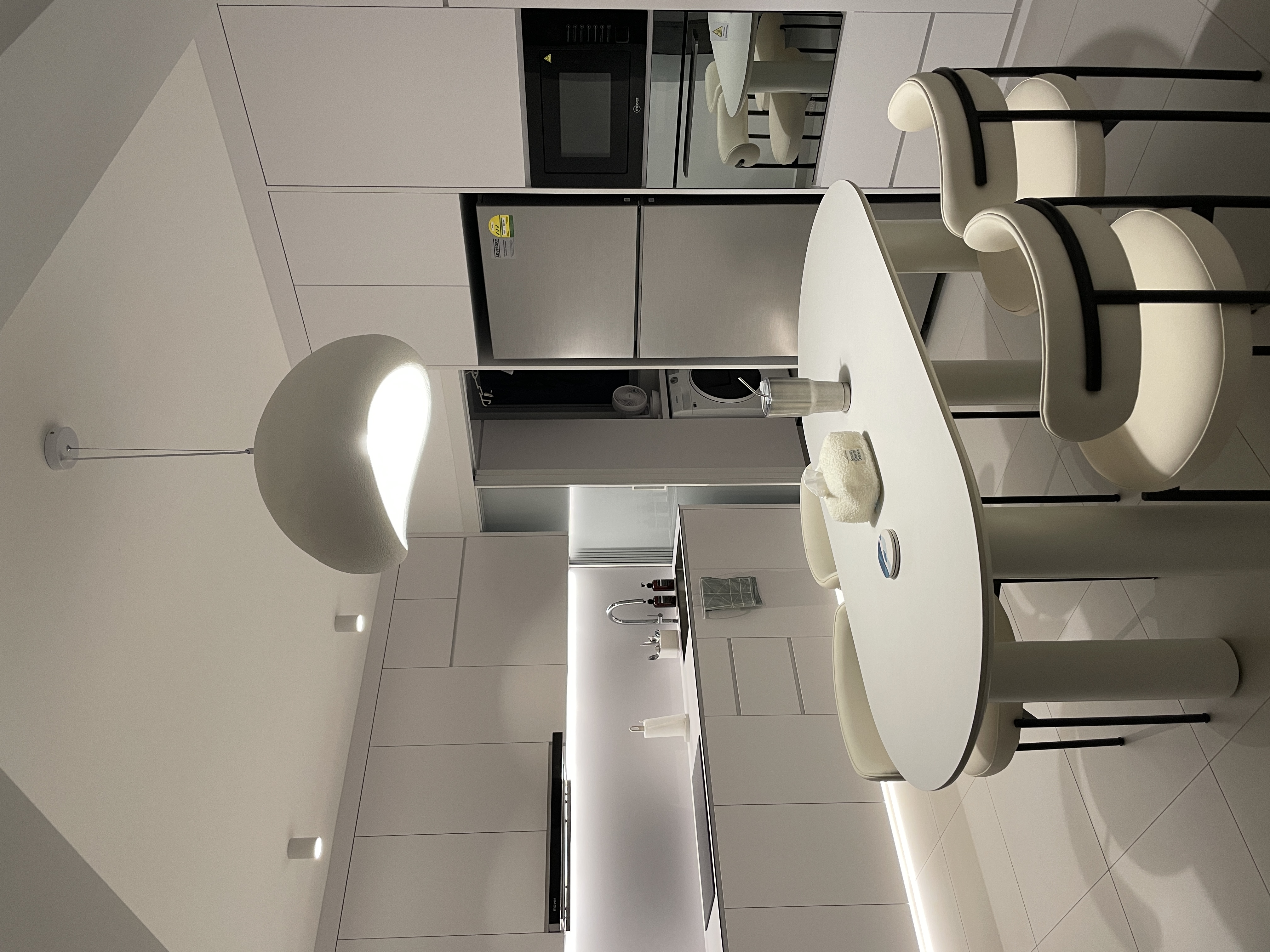 A Peek Inside Our Minimalist Sanctuary  - Modern kitchen with sleek design, minimalist decor, contemporary appliances, large