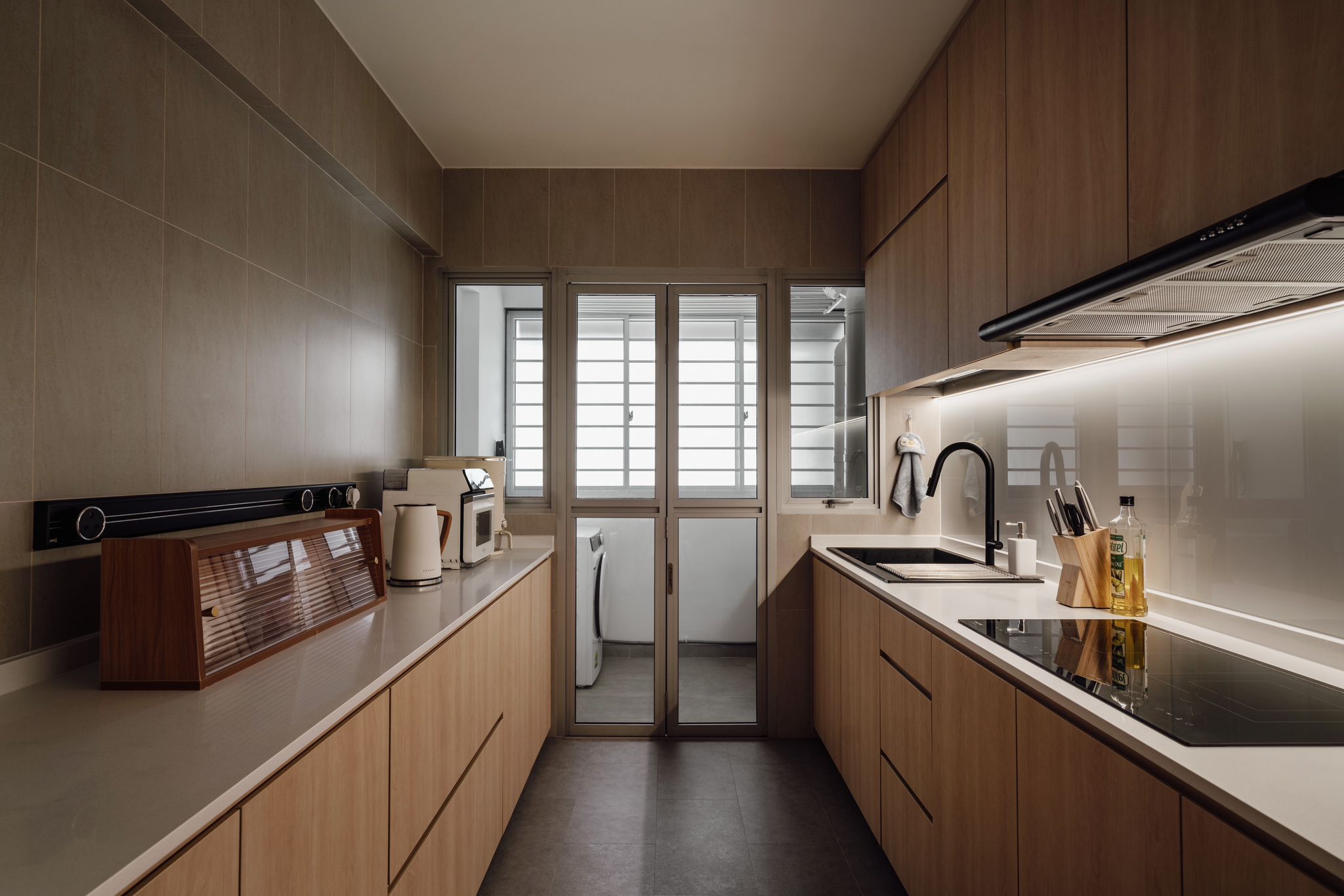 Inside our 5room Japanese inspired home - Wooden kitchen cabinets, modern appliances, white countertops, black range hood