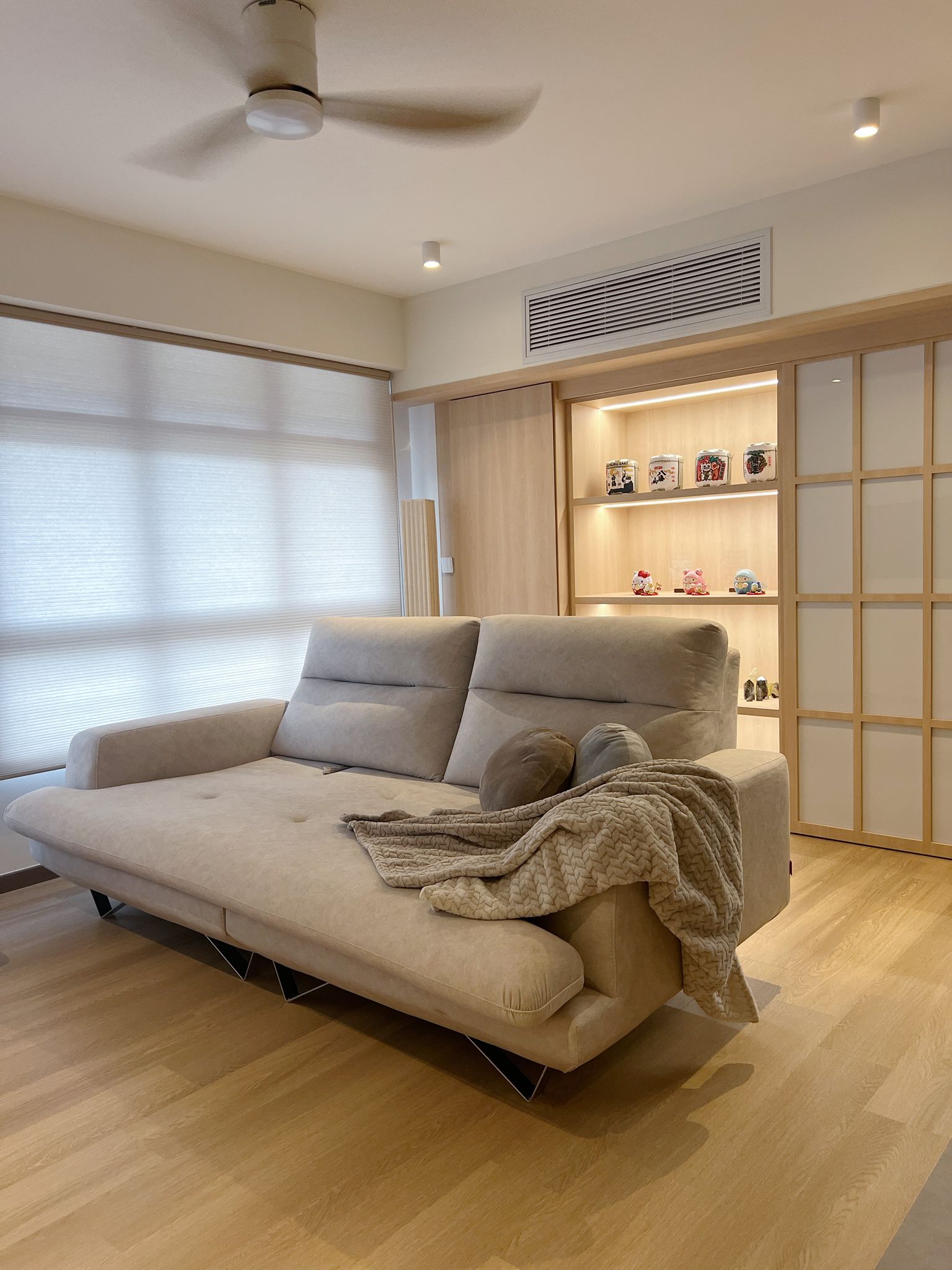 Inside our 5room Japanese inspired home - Modern minimalist living room, beige sectional sofa, soft natural light, wooden