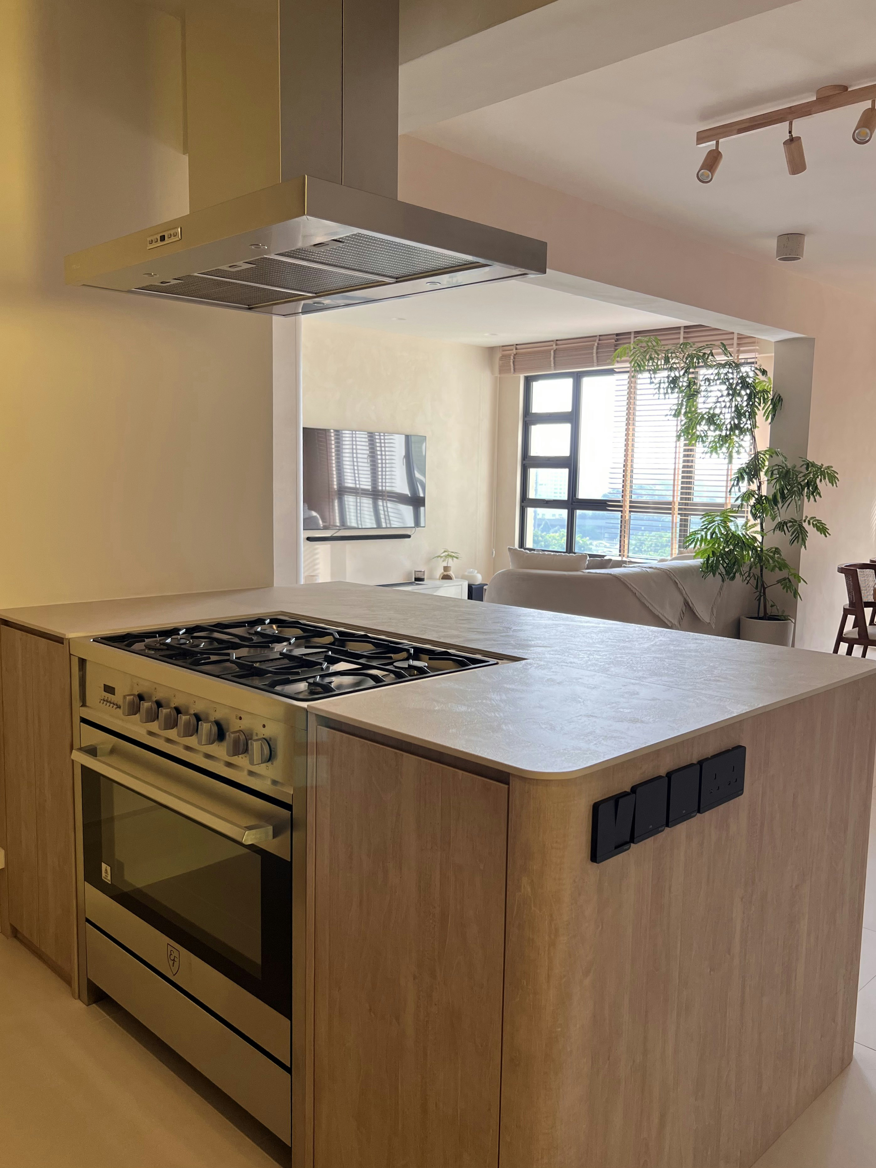 Neutral Palette Japandi Haven in Tampines  - Modern kitchen with sleek stainless steel appliances, beige cabinetry, large