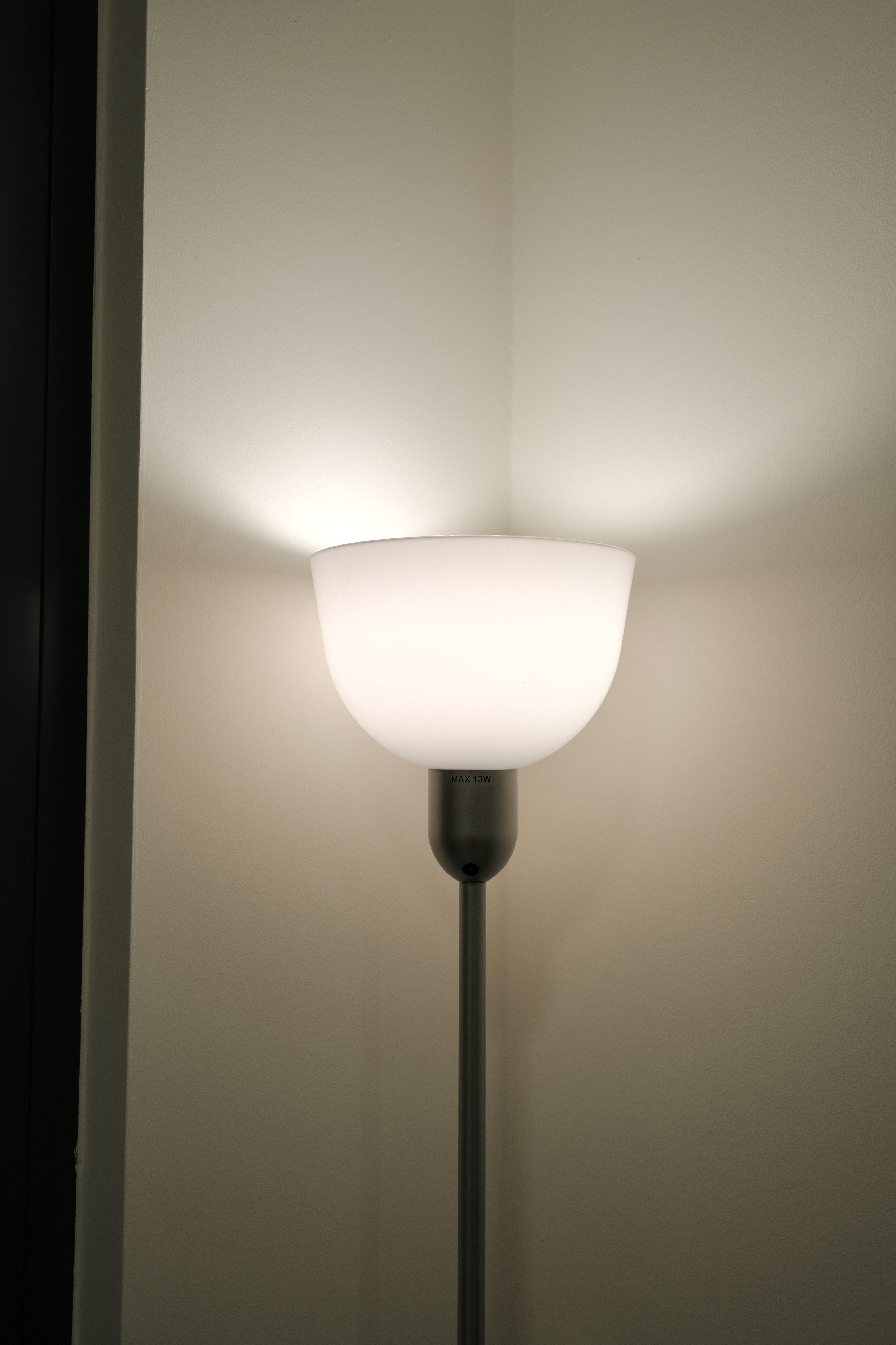 Minimalist Cozy Living in the North-East - Modern wall-mounted lamp, minimalist design, soft glow, white lampshade, sleek
