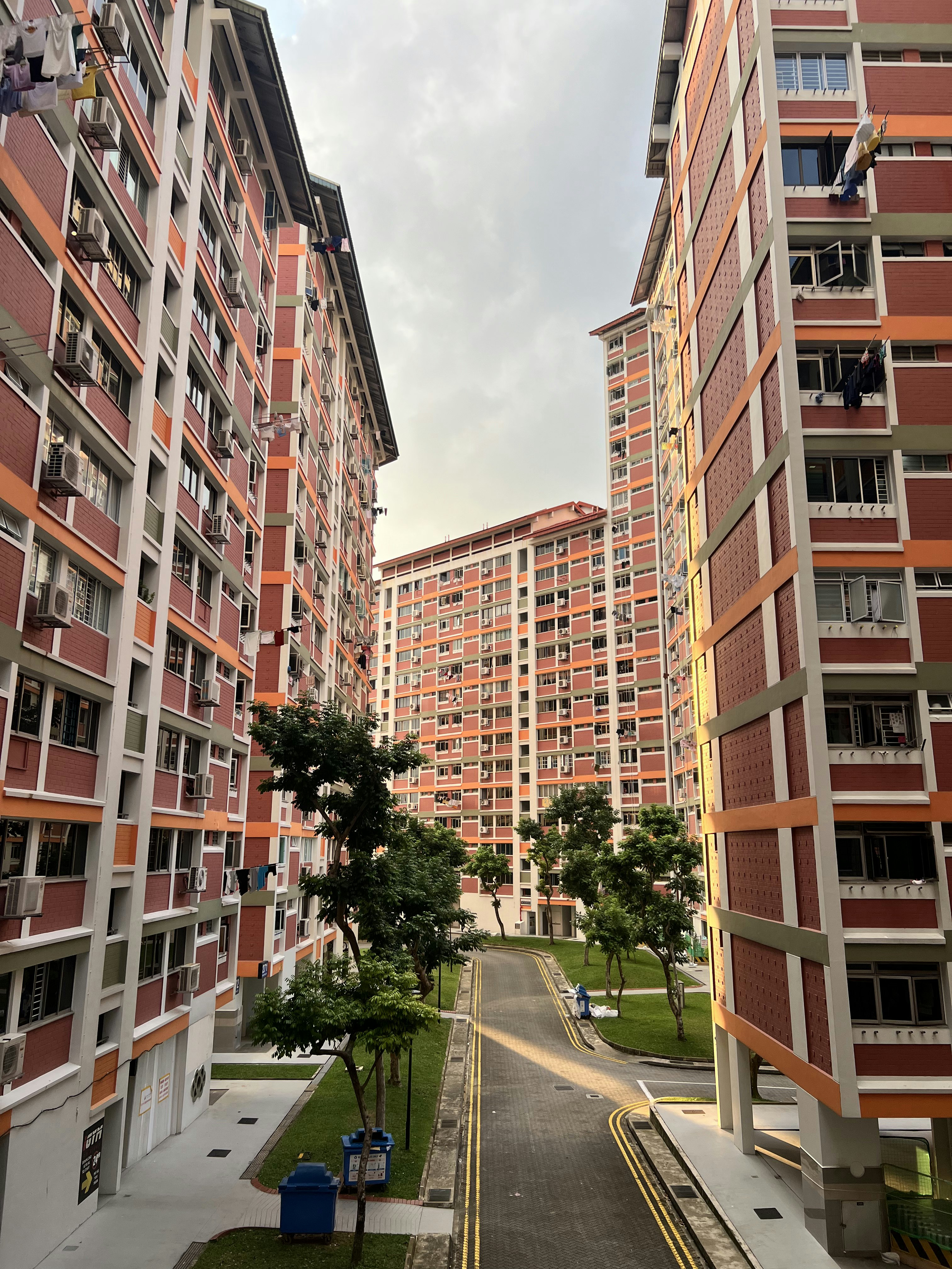 Transforming a 92' flat for 2 92's 🙉🙊 - Multi-story residential building, orange and white facade, air conditioning units