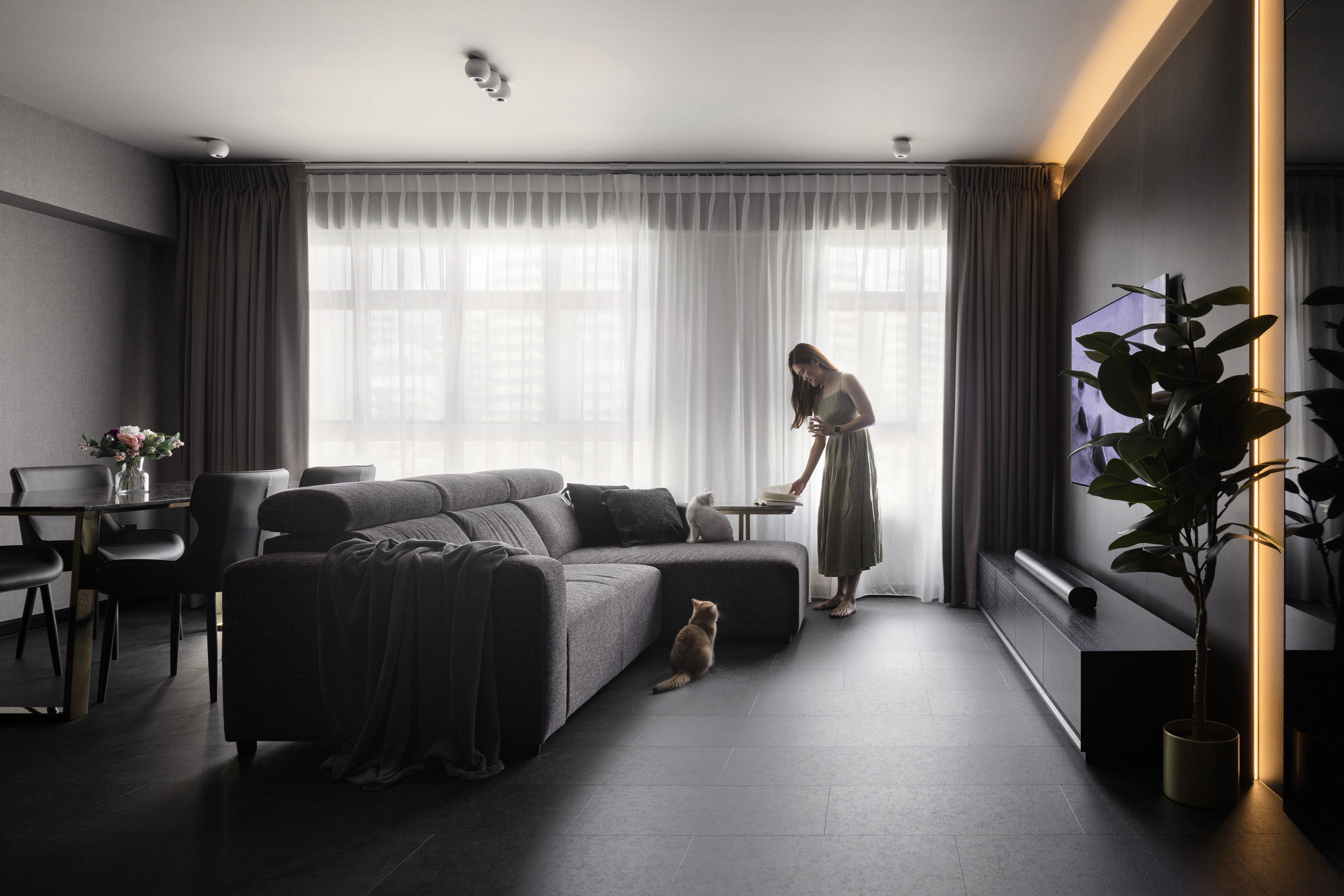 Inside The $70K Reno Of A Dark Minimalist Luxury 5-Room HDB Flat - Modern minimalist living room, soft natural light