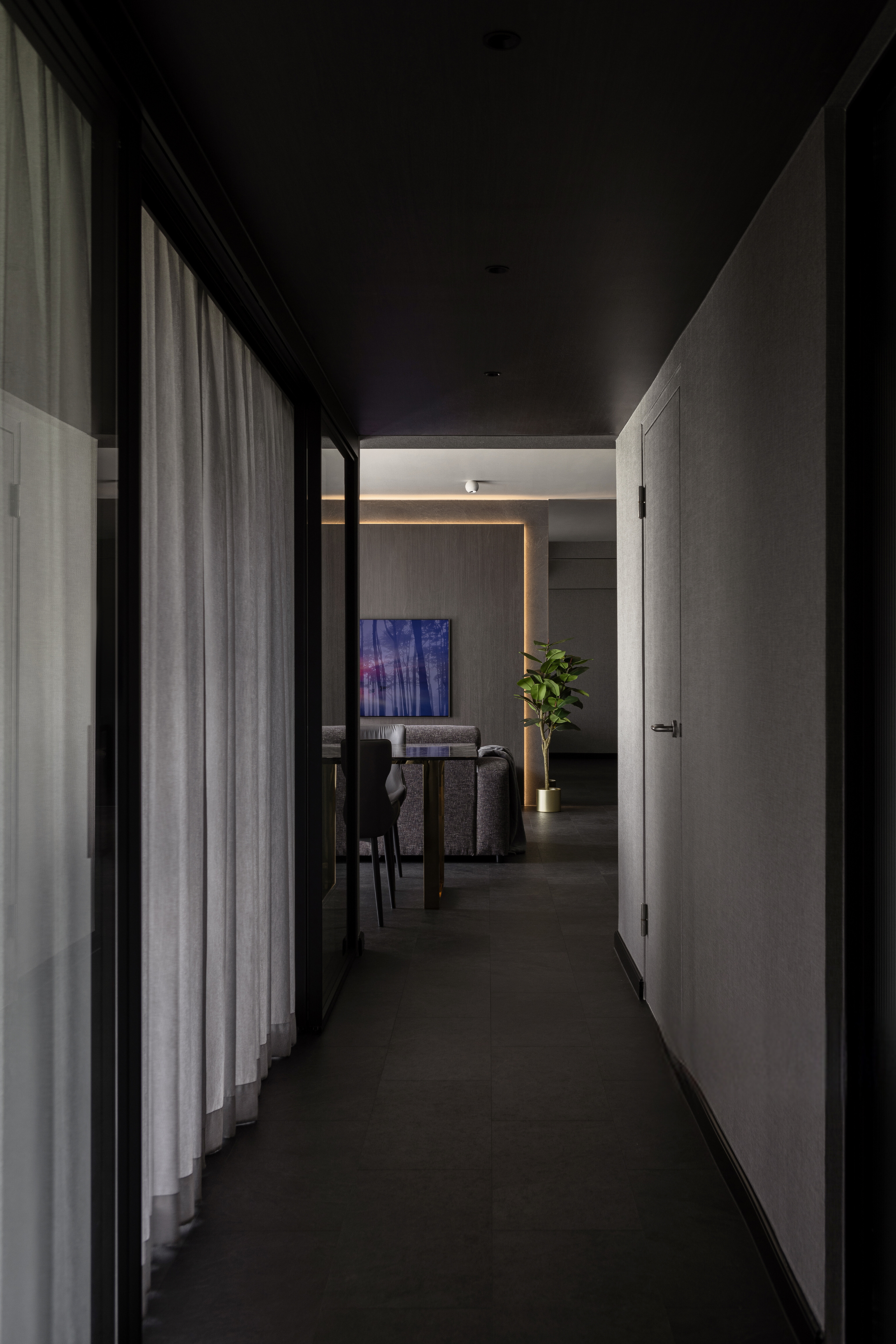 Inside The $70K Reno Of A Dark Minimalist Luxury 5-Room HDB Flat - Modern minimalist hallway, sleek black ceiling, soft