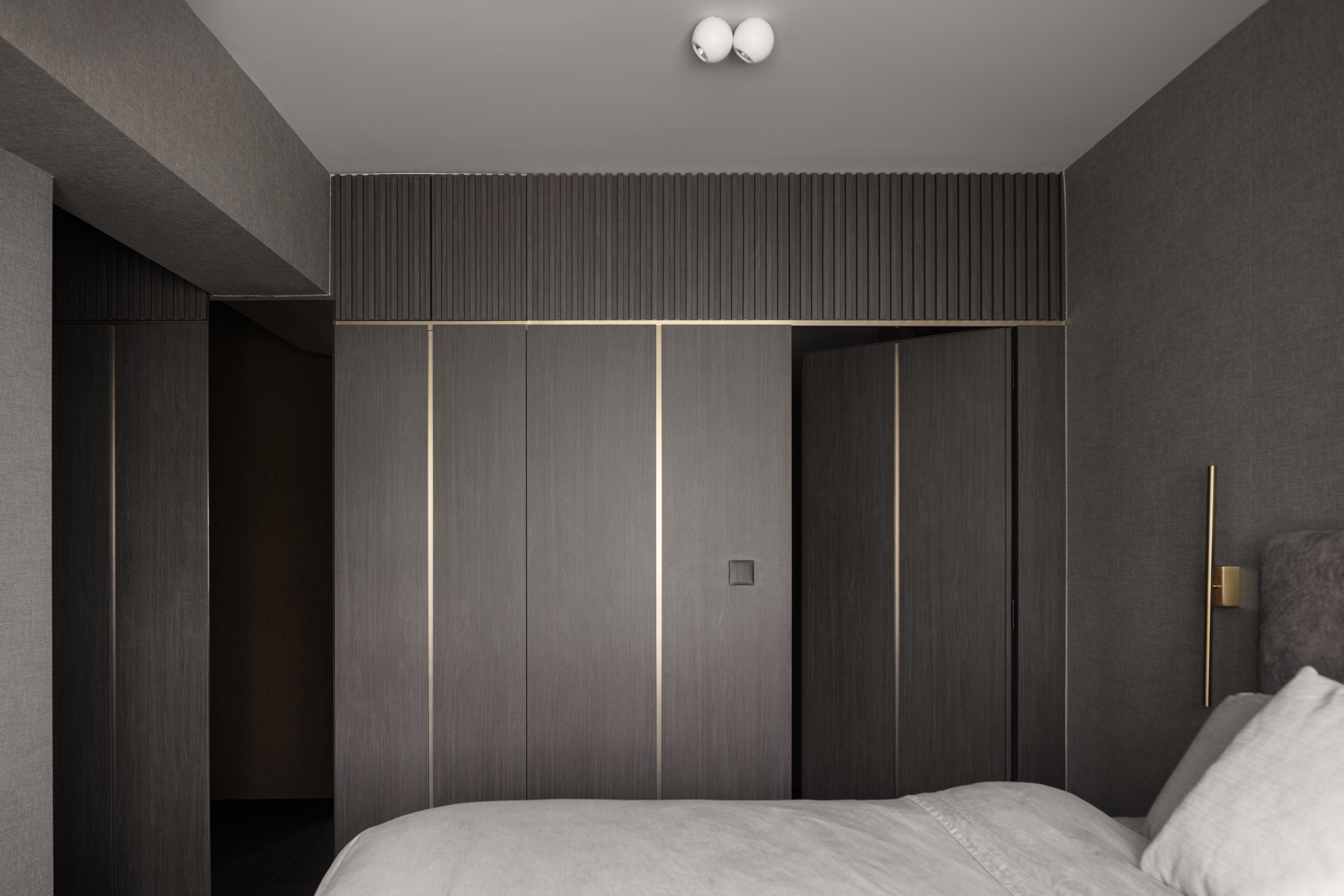 Inside The $70K Reno Of A Dark Minimalist Luxury 5-Room HDB Flat - Modern minimalist bedroom, sleek wooden wardrobe, dark