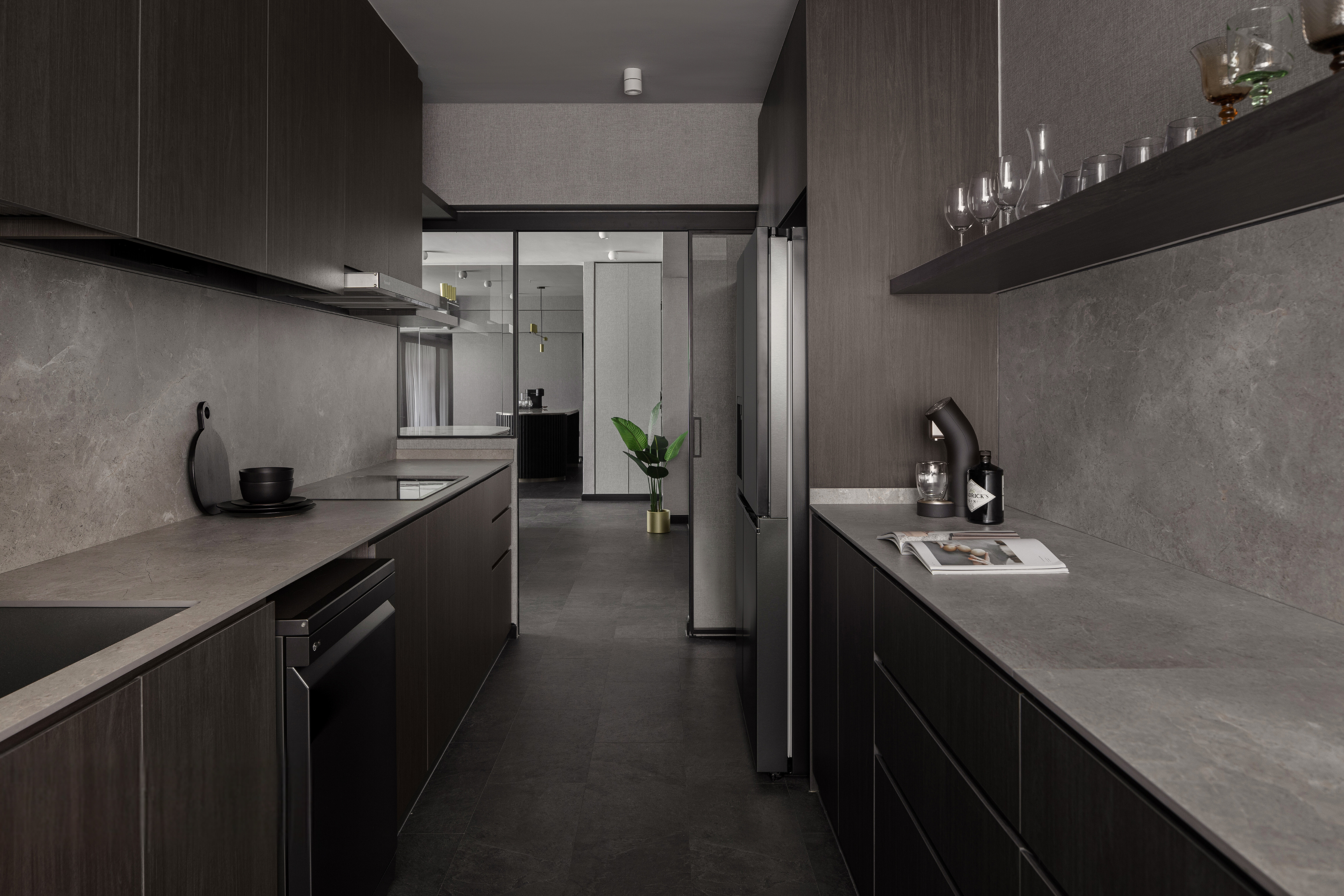 Inside The $70K Reno Of A Dark Minimalist Luxury 5-Room HDB Flat - Modern kitchen with sleek dark cabinetry, gray textured