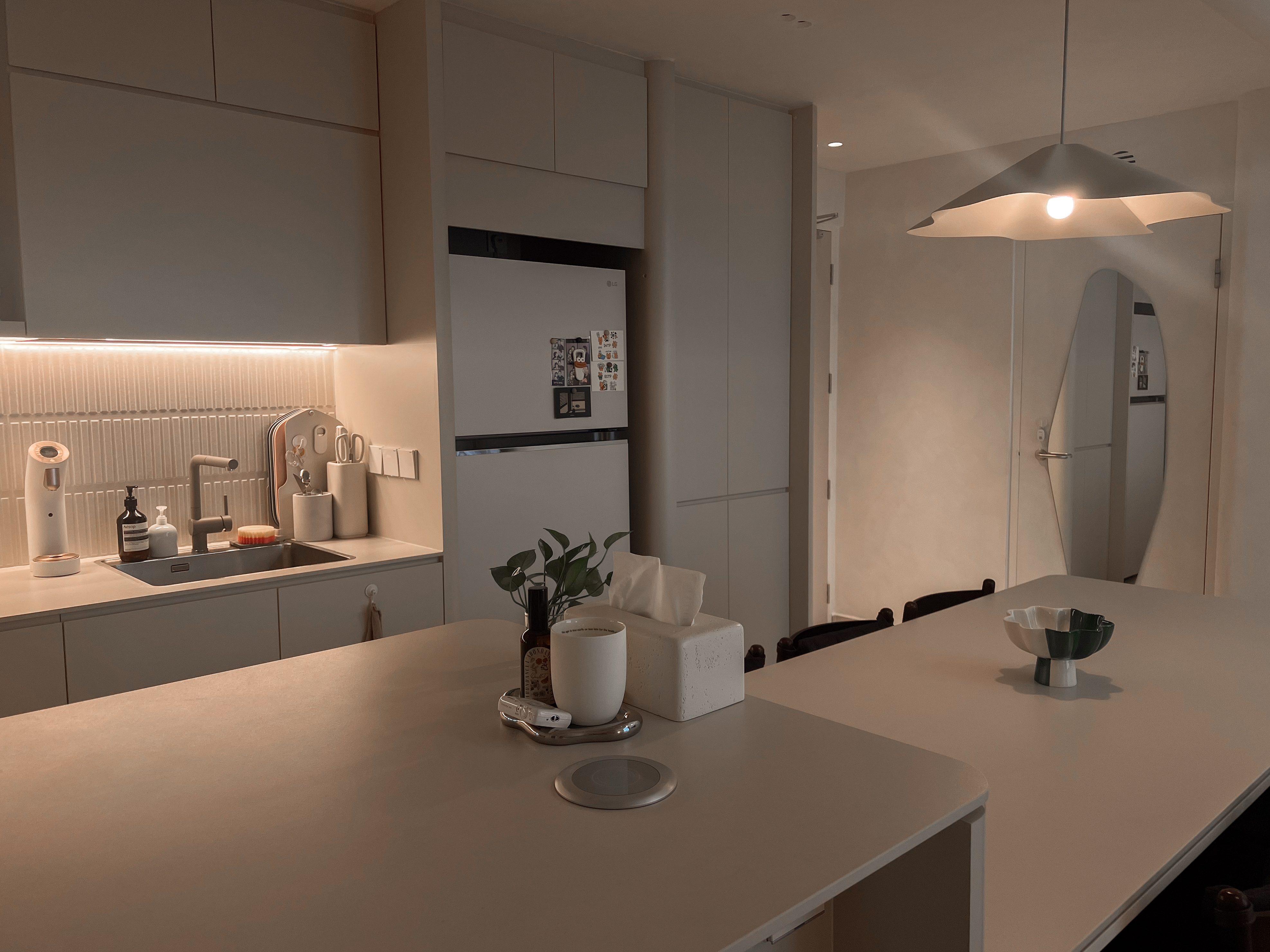 A peek inside our $130K low floor hdb loft 👀 - Modern kitchen with sleek design, minimalist decor, soft ambient lighting