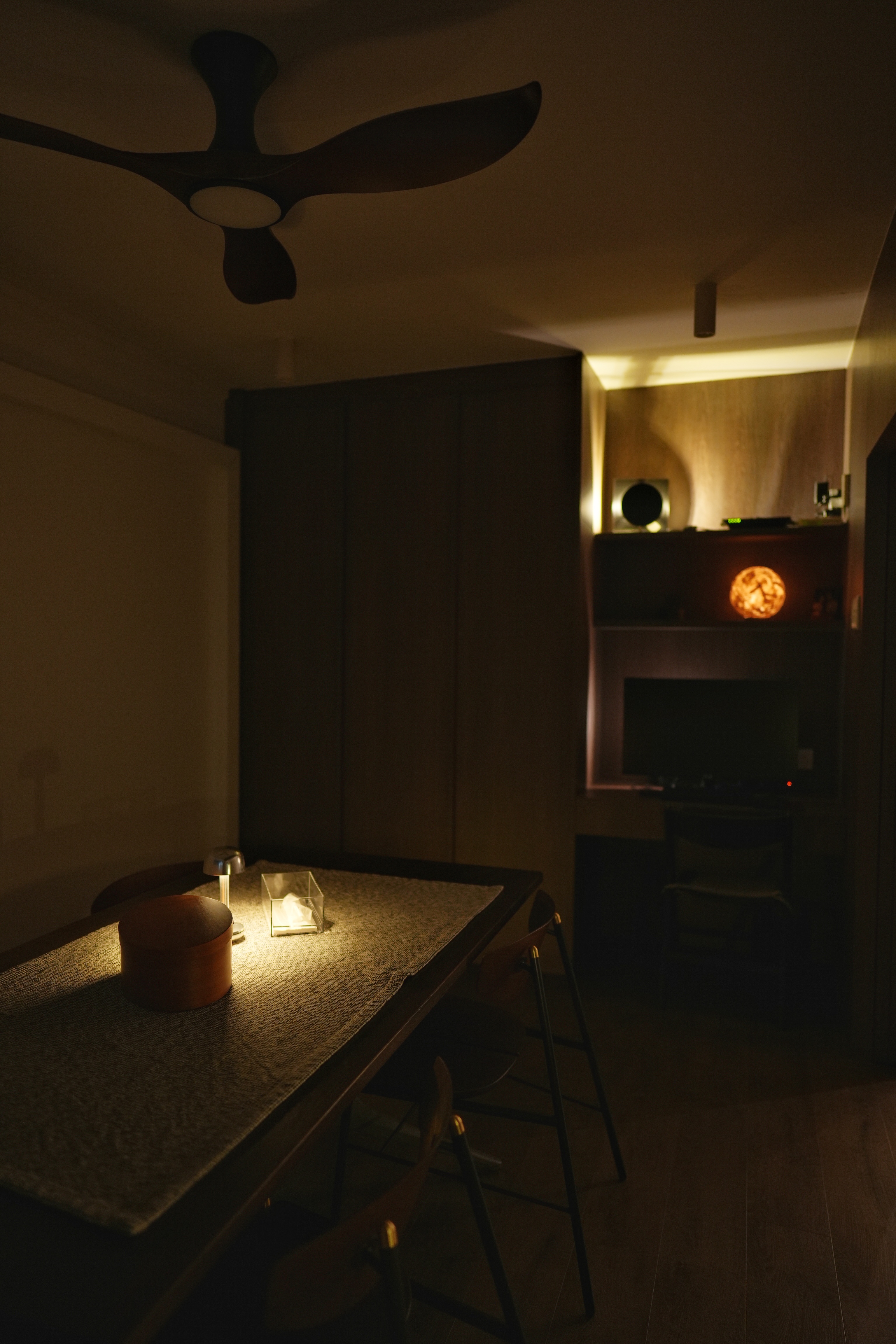 Cosy, Moody, Minimalist HDB in the Heart of the City - dimly lit room, cozy ambiance, soft lighting, warm tones, wooden