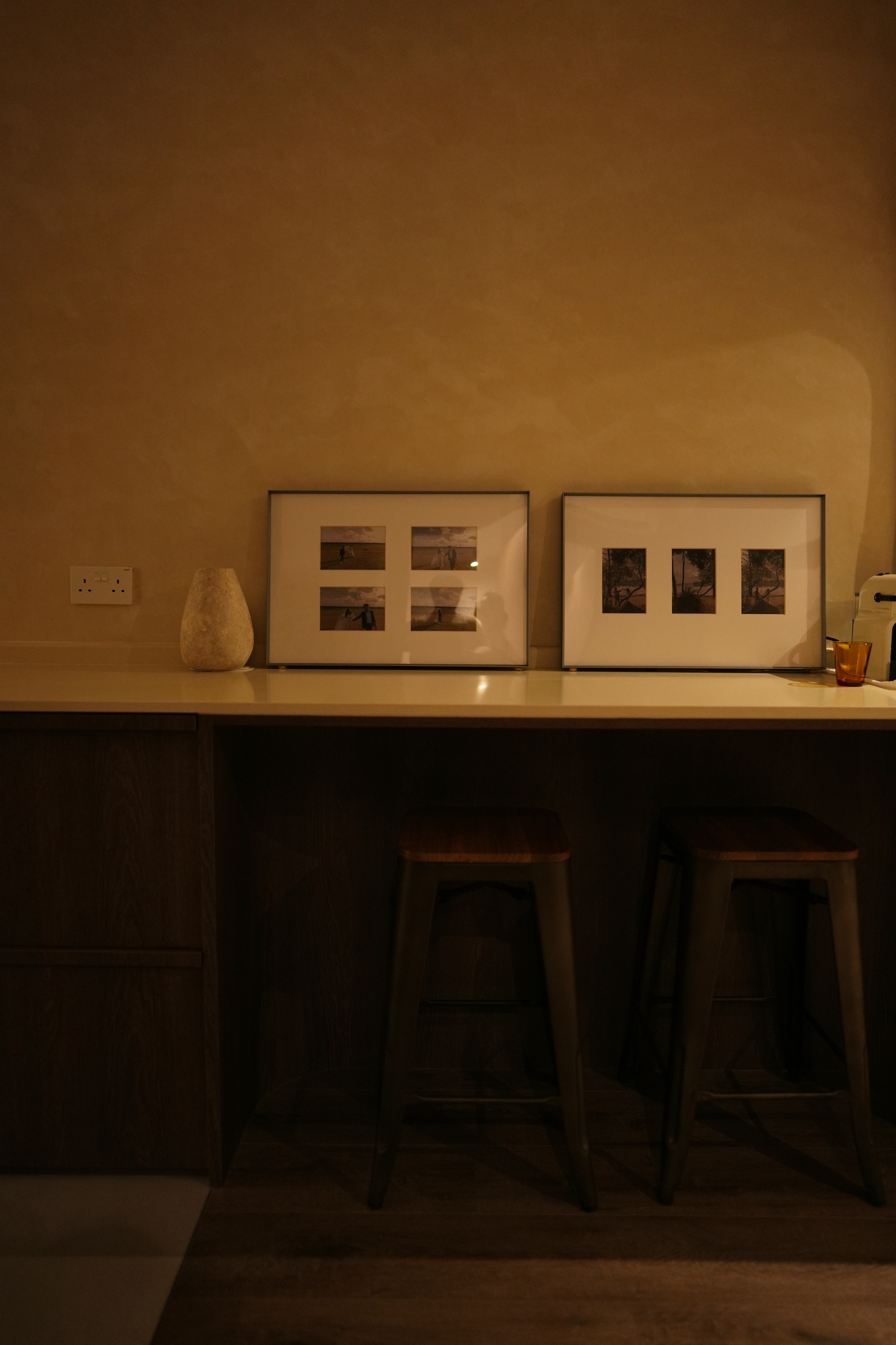 Cosy, Moody, Minimalist HDB in the Heart of the City - dimly lit room, cozy corner, wooden furniture, brown walls, modern