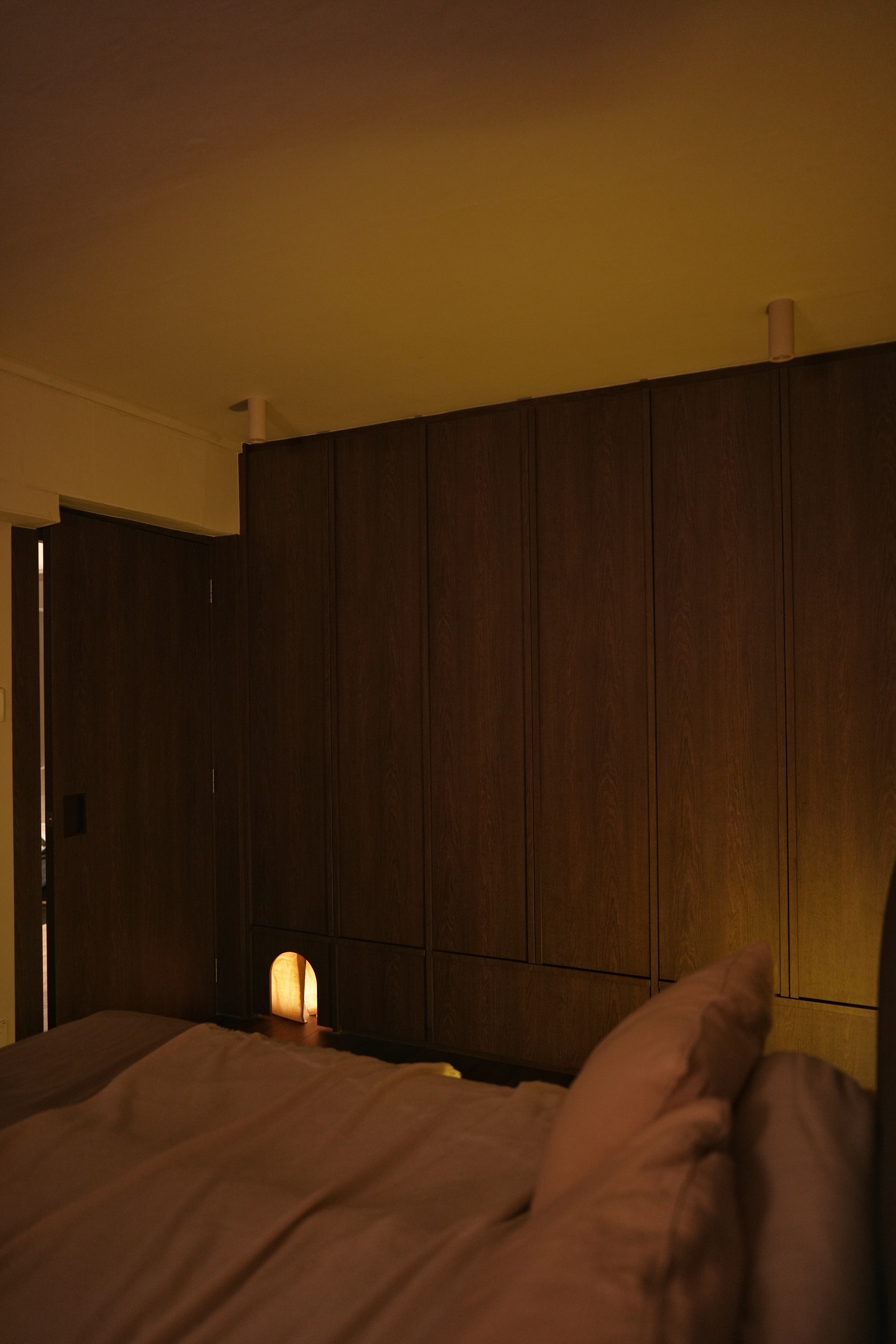 Cosy, Moody, Minimalist HDB in the Heart of the City - Wooden wardrobe, dimly lit room, cozy ambiance, soft lighting, warm