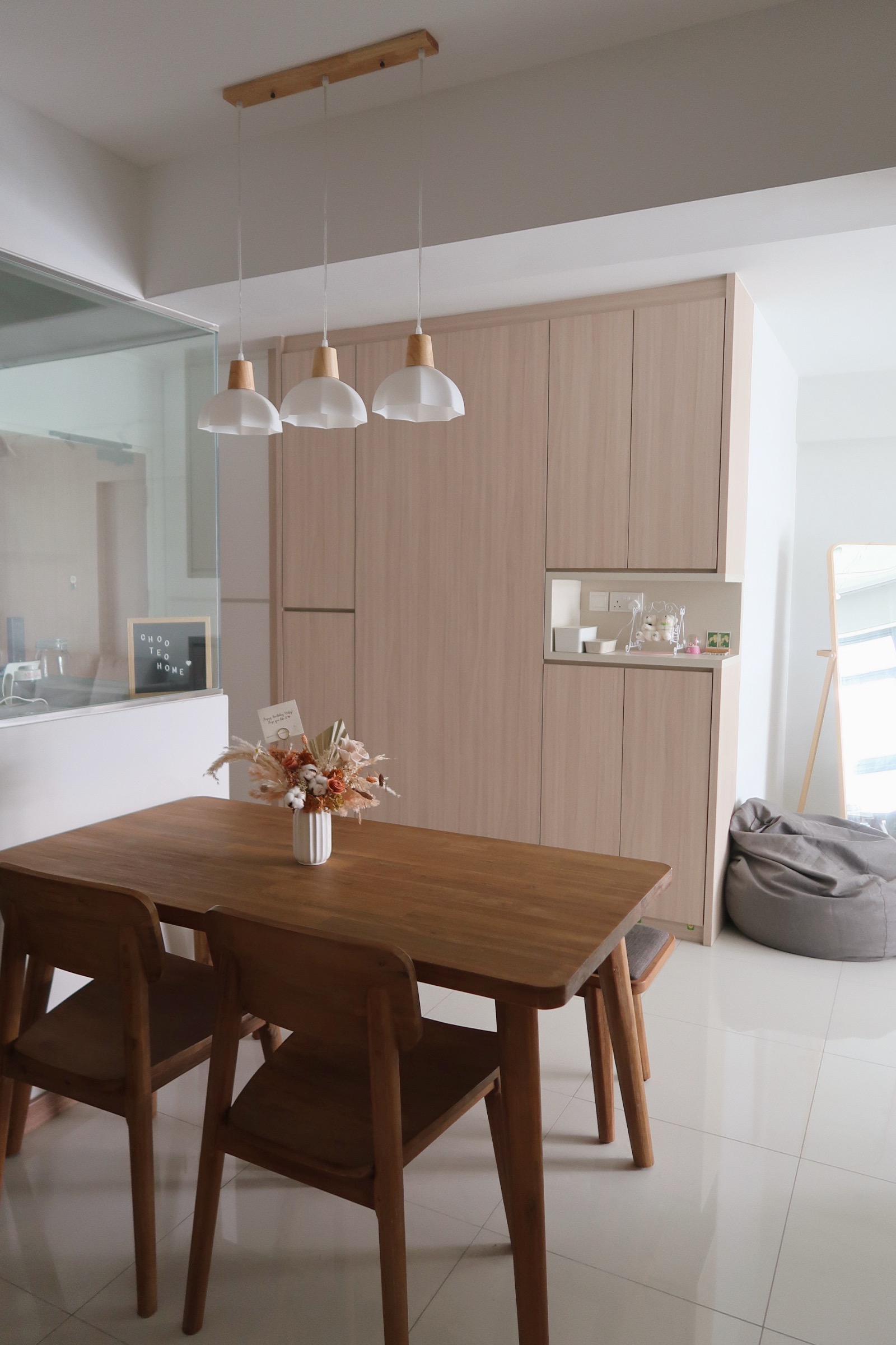 Simple Scandinavian home under $30k renovation in the East - Wooden dining table, minimalist kitchen, modern decor, light