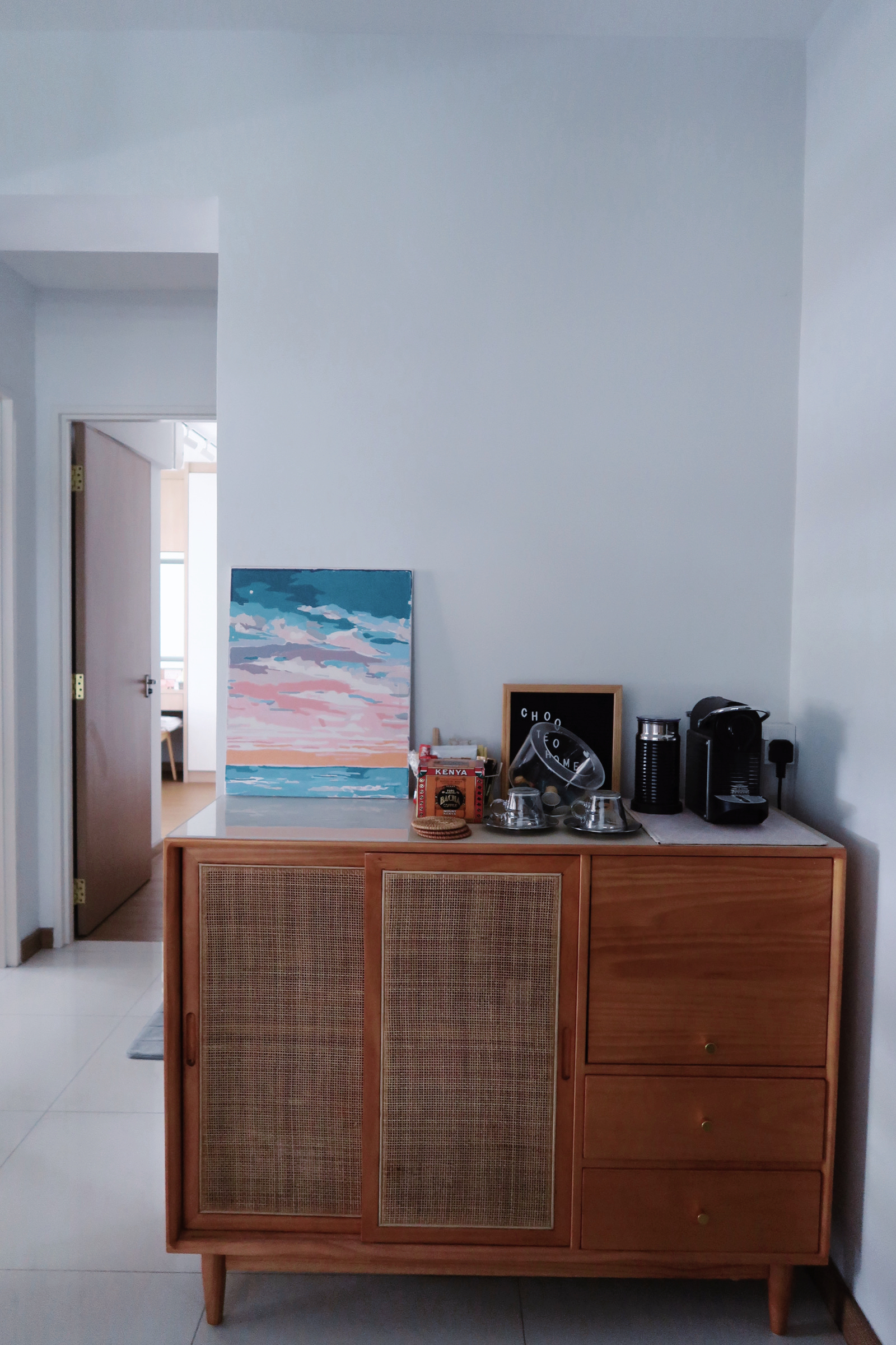 Simple Scandinavian home under $30k renovation in the East - Interior view of a room featuring a wooden cabinet with a