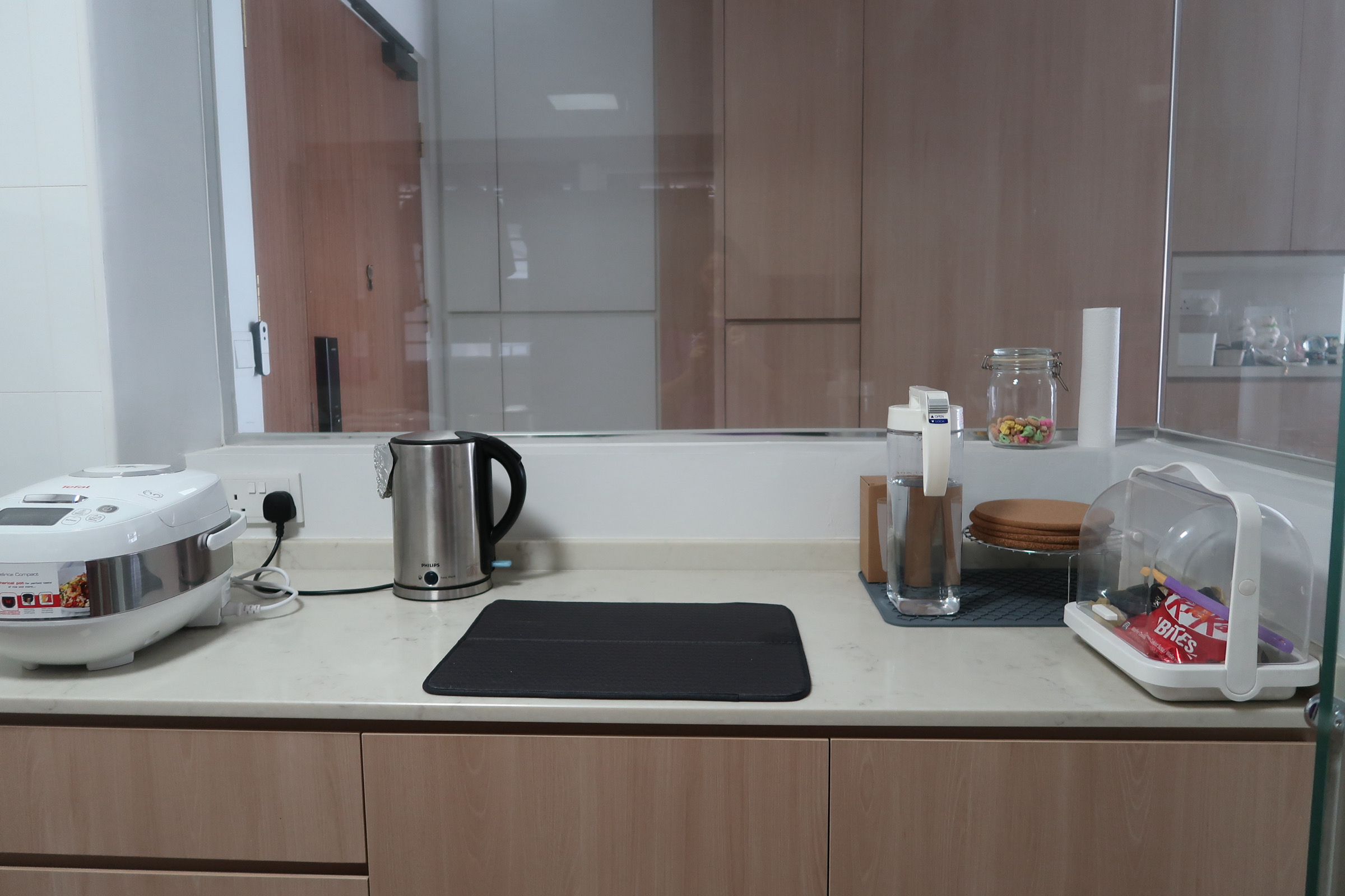 Simple Scandinavian home under $30k renovation in the East - Instant pot, rice cooker, kettle, black mat, kitchen counter