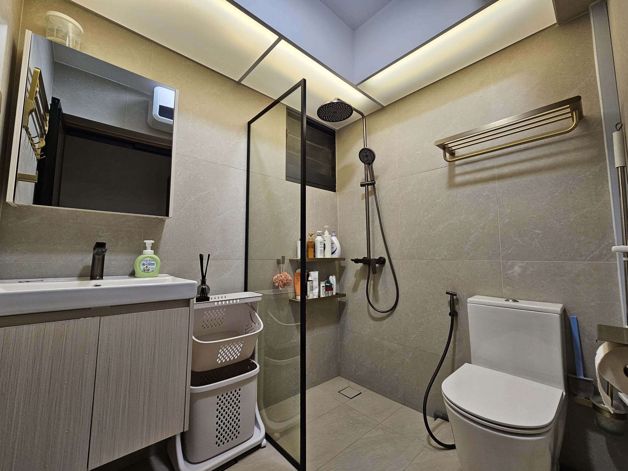 House Tour: Exploring Dark Wood Mid-Century Modern Theme - Modern bathroom with sleek design, beige tiles, built-in sink and