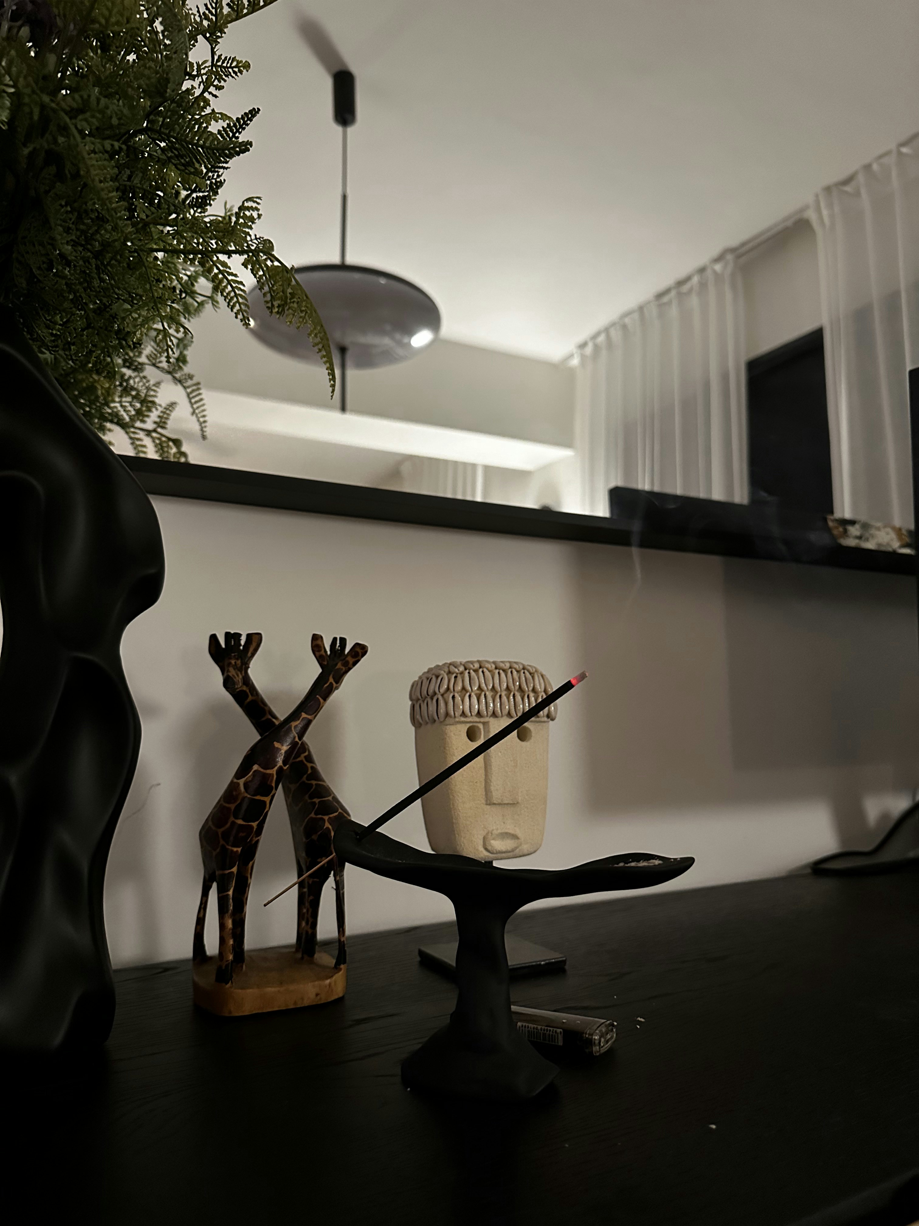 Bauhaus cathaus - $38k 4BR Reno for an open, flexible space       - Giraffe figurine, black vase, modern interior, abstract