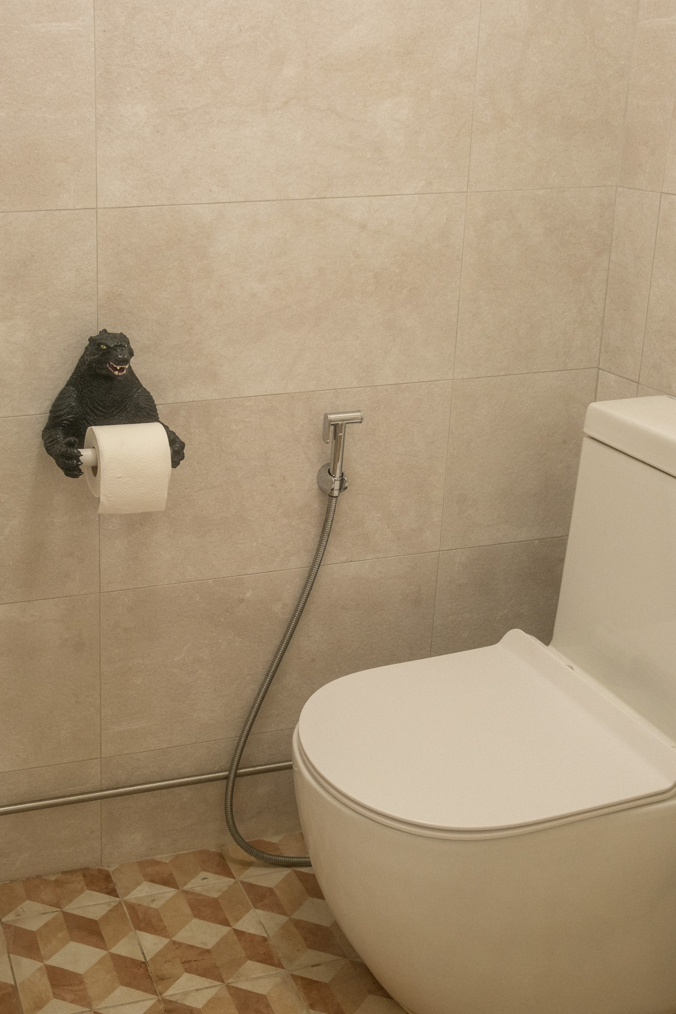 Maximising space in our cosy & quirky home with cats - Toilet with humorous decoration, black bear figure on wall, toilet